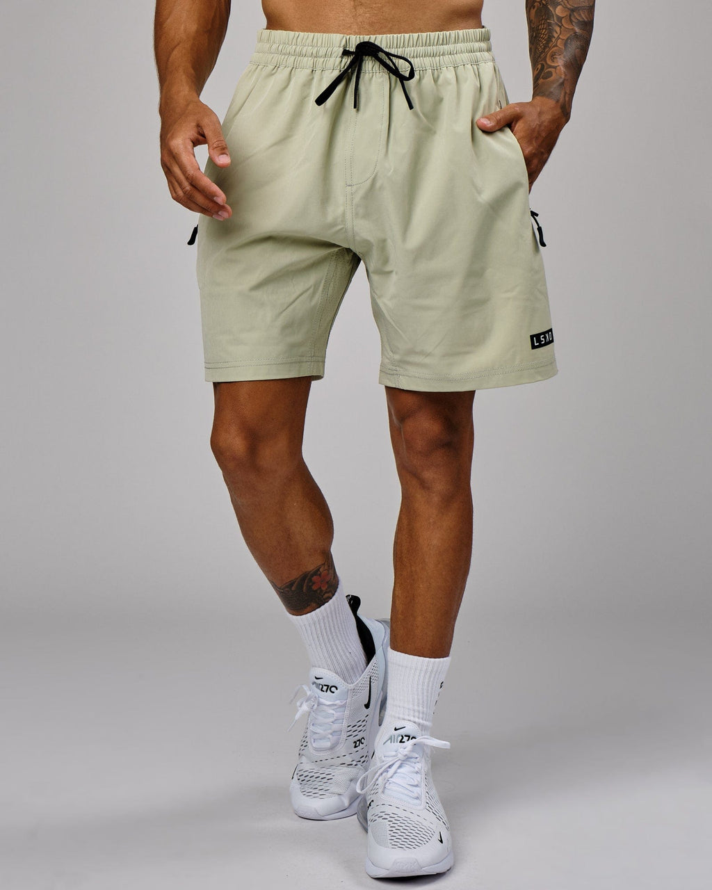 Model wearing Rep 7" Performance Short - Desert Sage