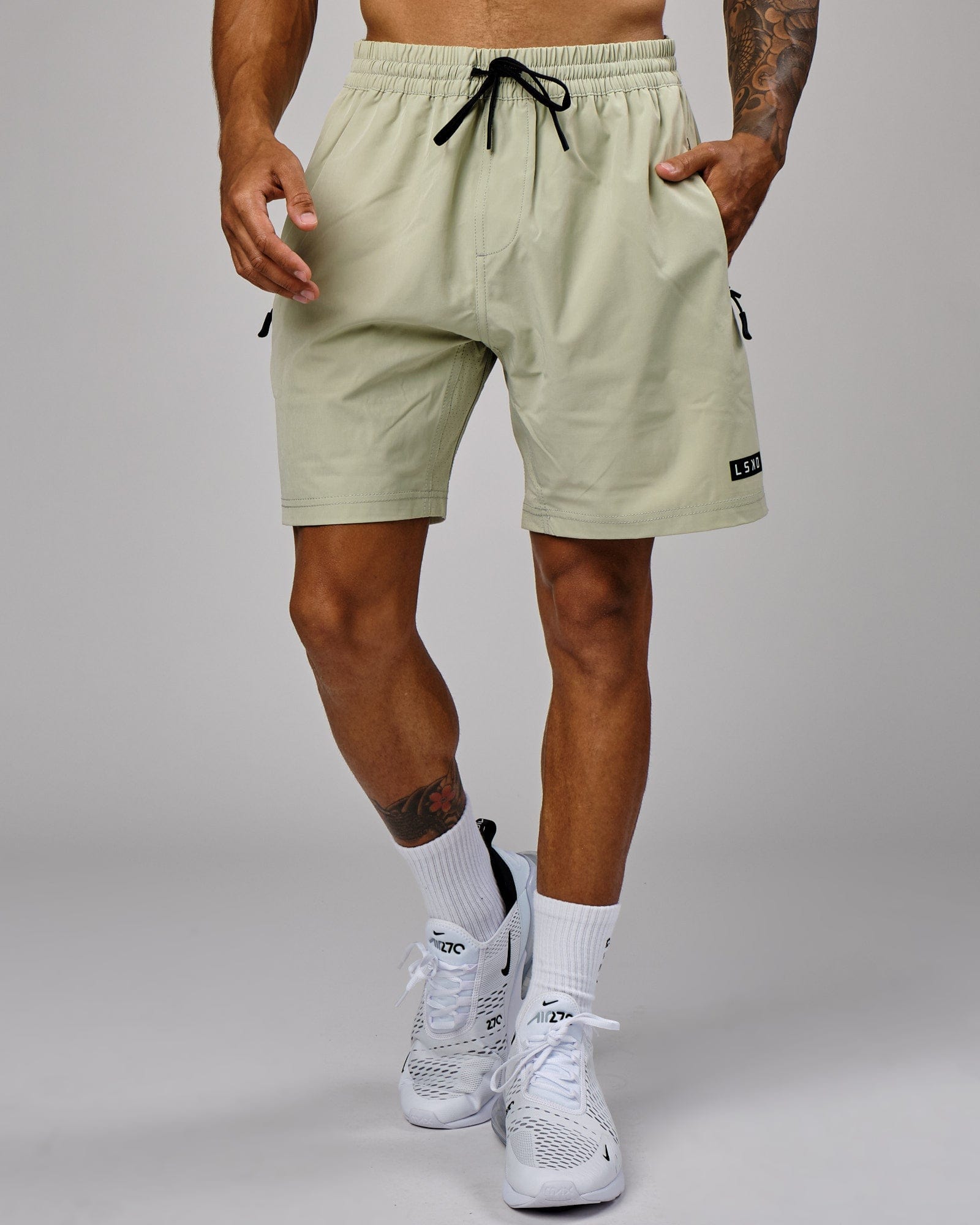 Model wearing Rep 7" Performance Short - Desert Sage