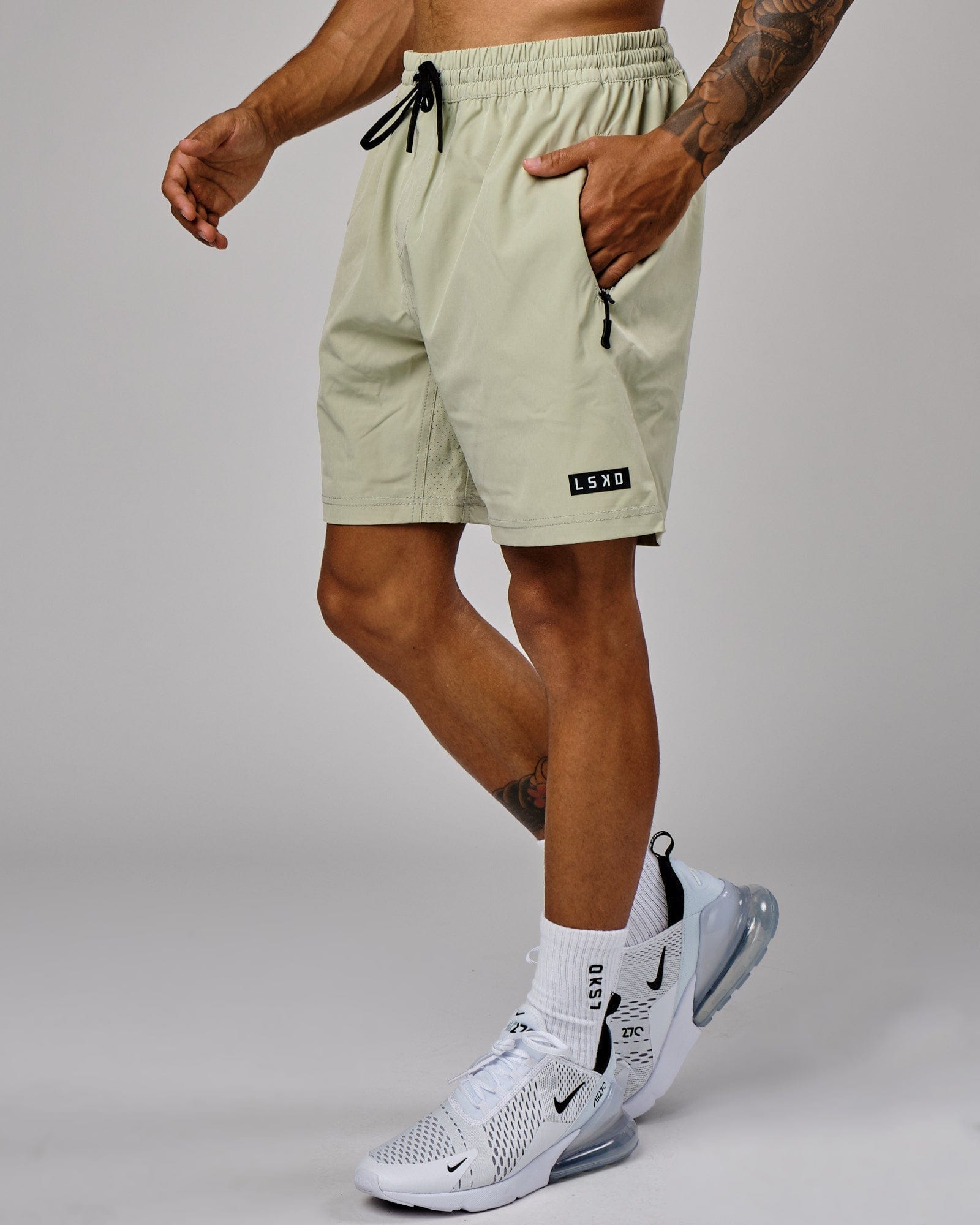 Model wearing Rep 7" Performance Short - Desert Sage