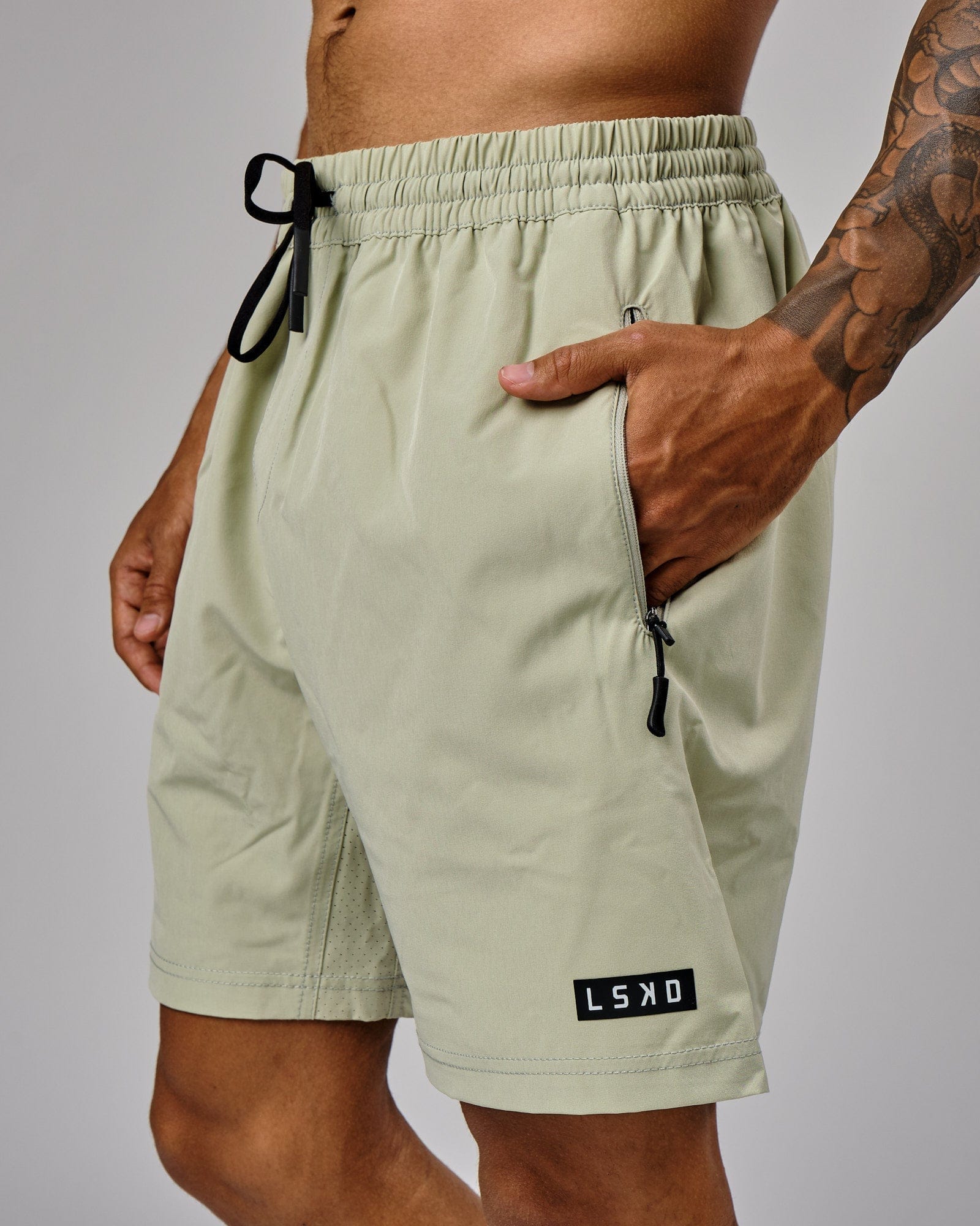 Model wearing Rep 7" Performance Short - Desert Sage