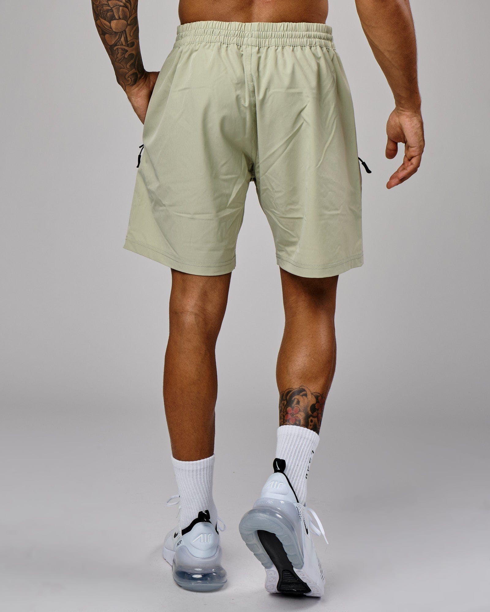 Model wearing Rep 7" Performance Short - Desert Sage