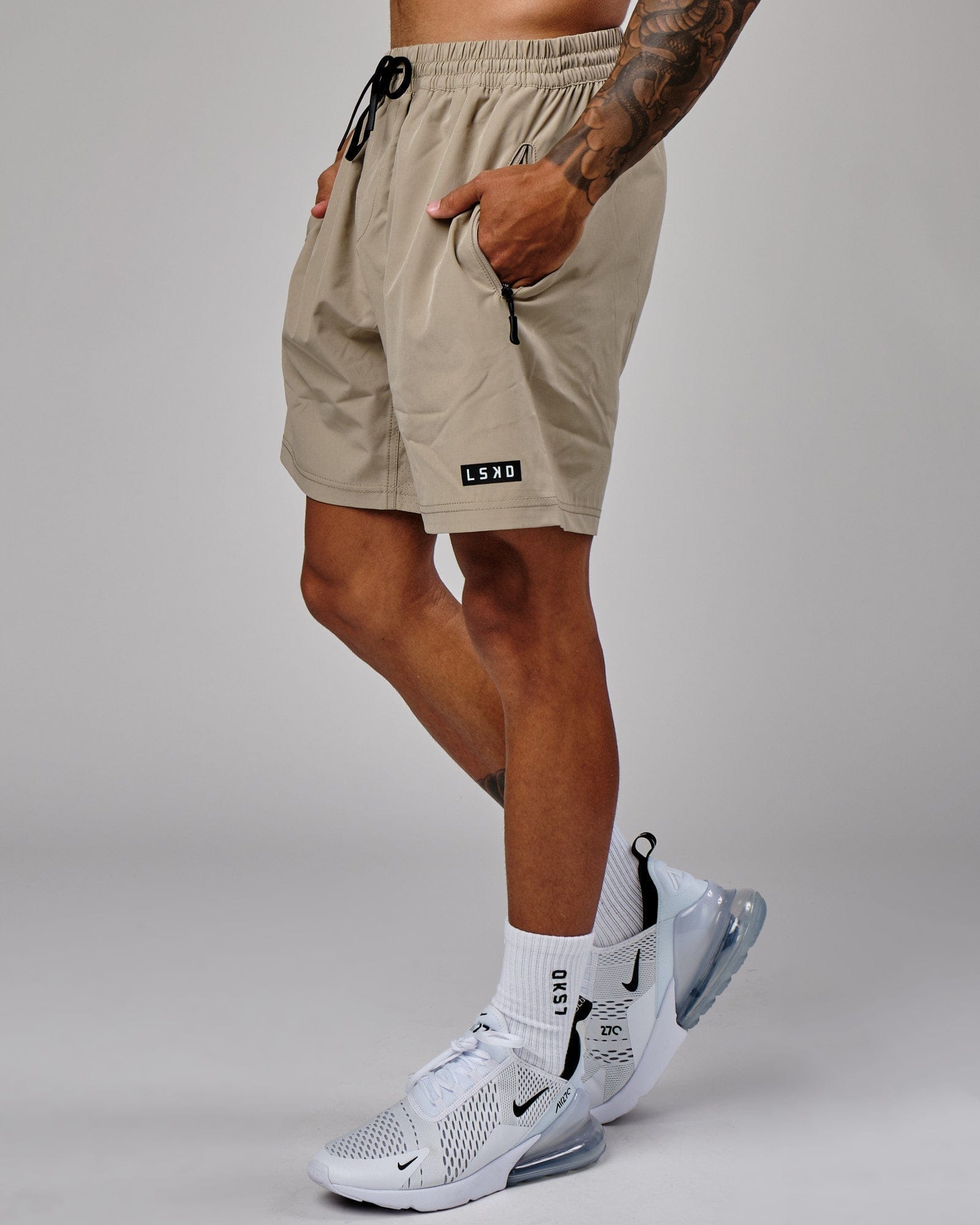 Model wearing Rep 7" Performance Short - Laurel Oak