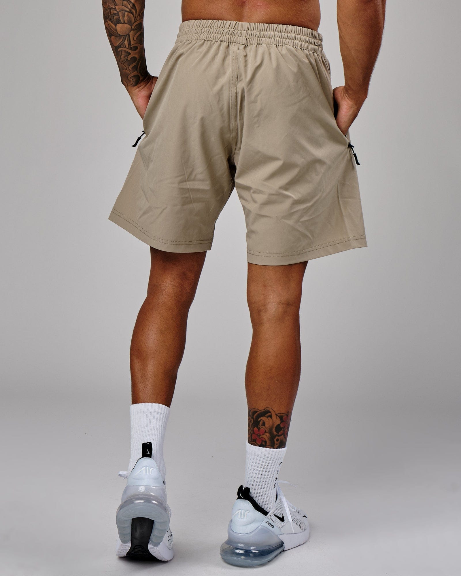 Model wearing Rep 7" Performance Short - Laurel Oak