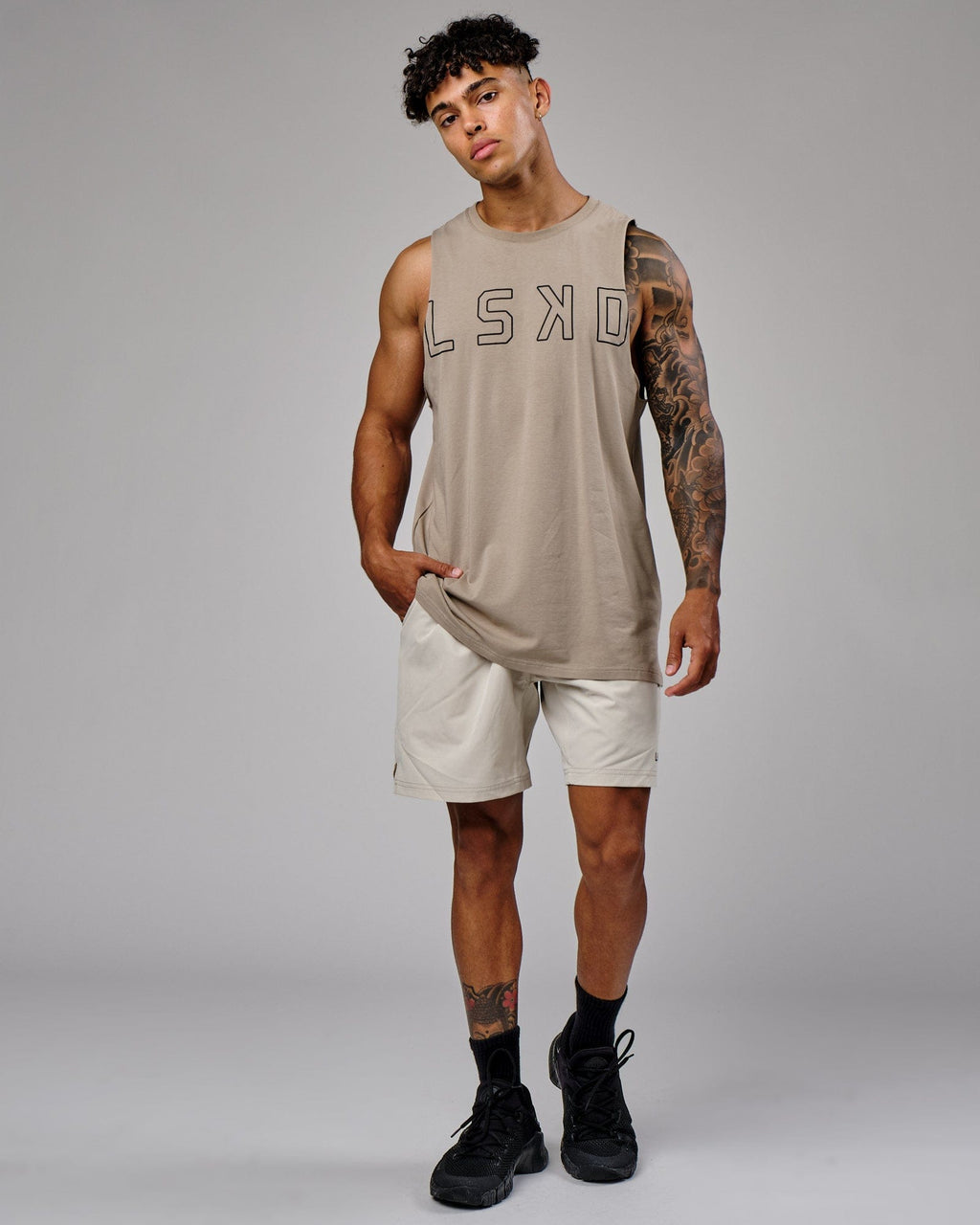 Model wearing Intensity 7" Performance Short - Bone