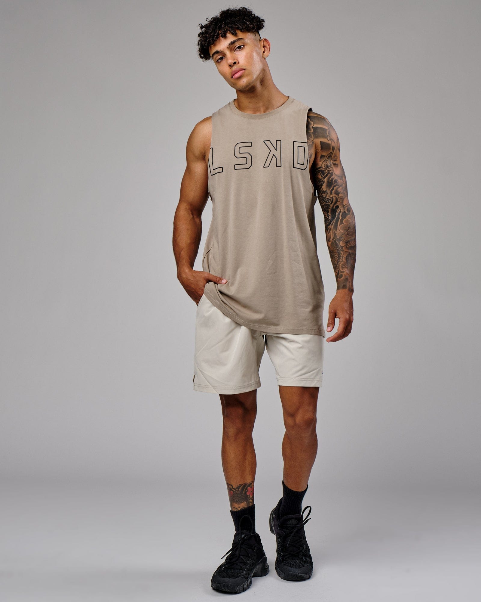 Model wearing Intensity 7" Performance Short - Bone