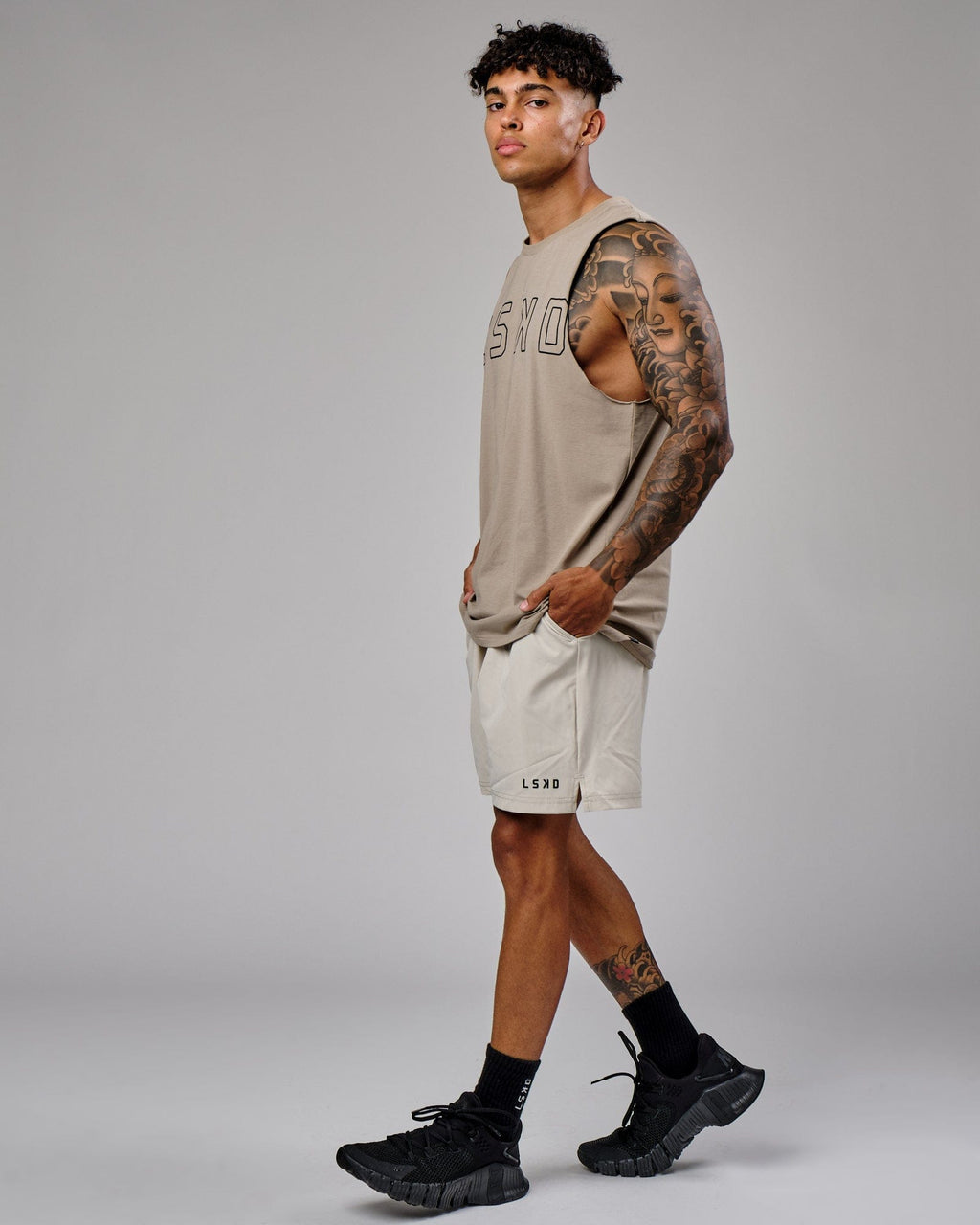 Model wearing Intensity 7" Performance Short - Bone