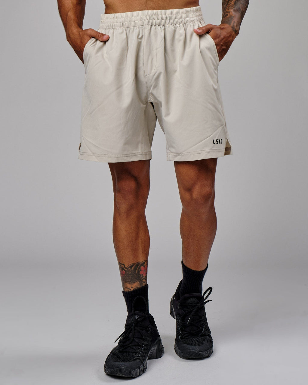 Model wearing Intensity 7" Performance Short - Bone