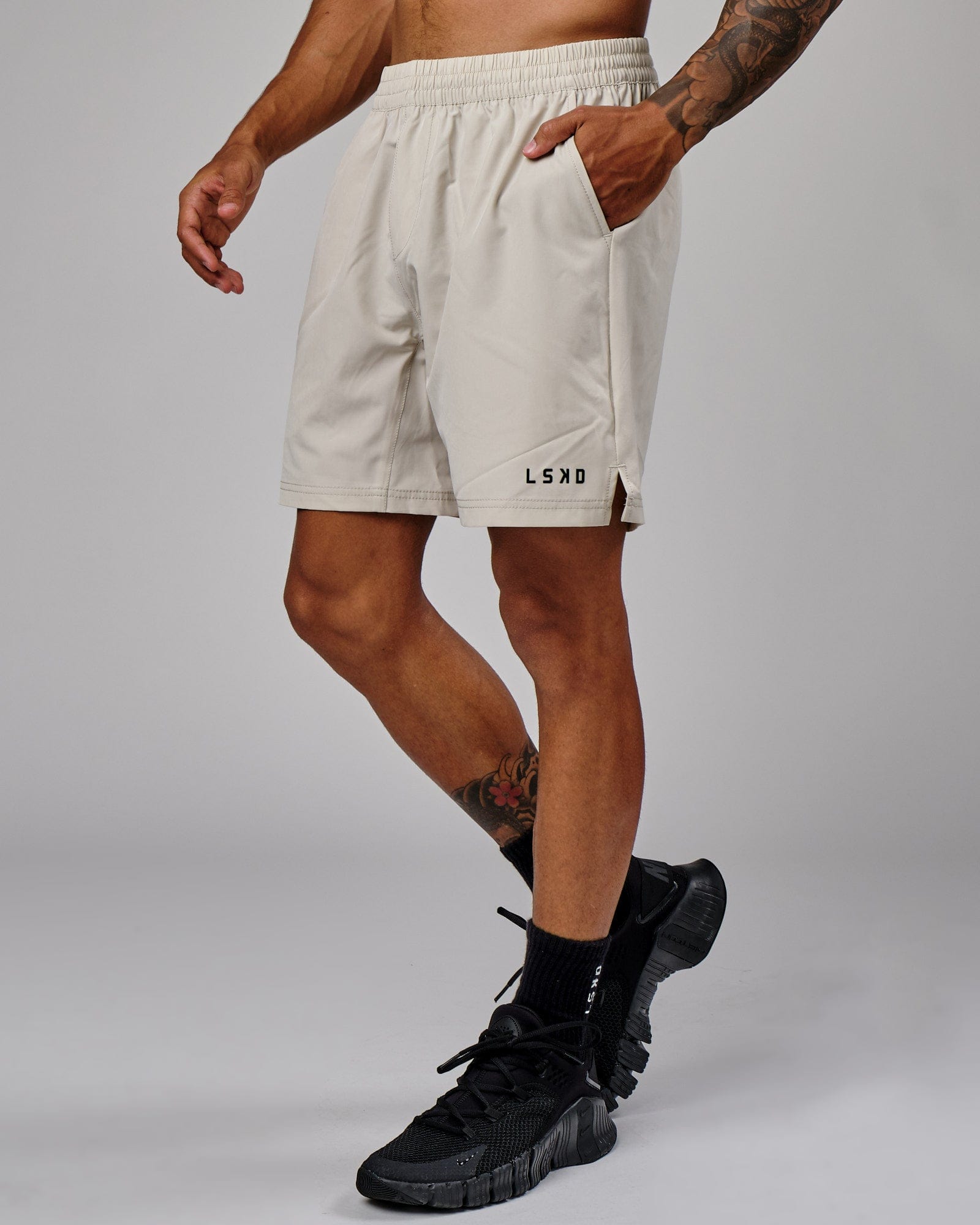 Model wearing Intensity 7" Performance Short - Bone
