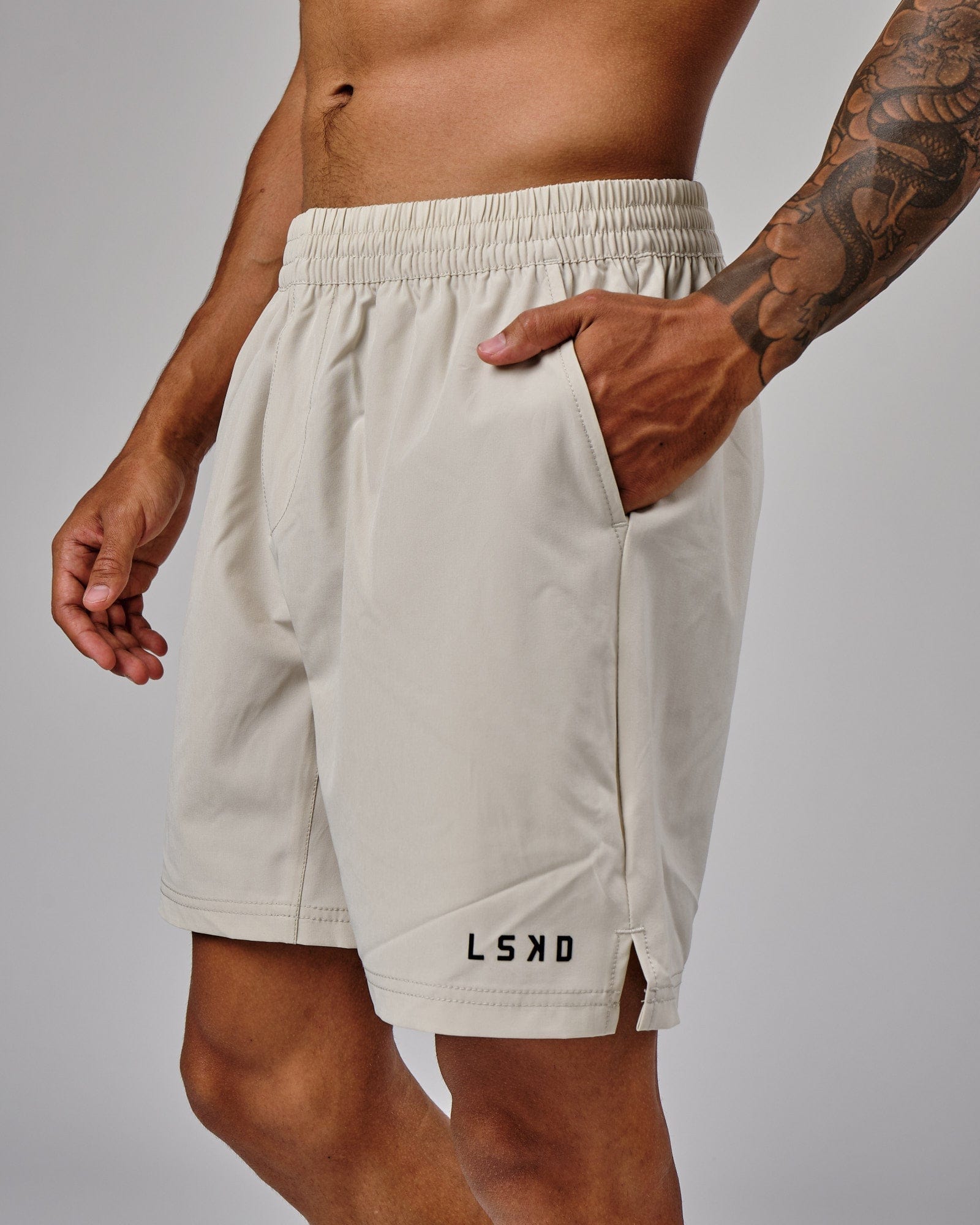 Model wearing Intensity 7" Performance Short - Bone