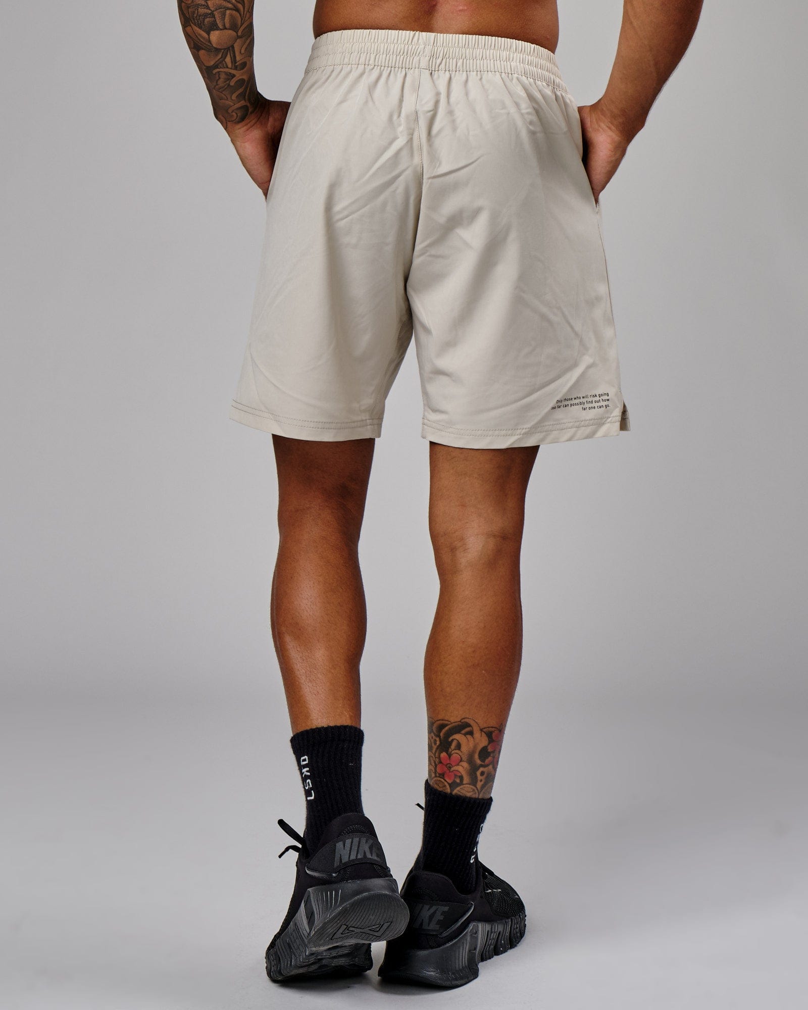 Model wearing Intensity 7" Performance Short - Bone