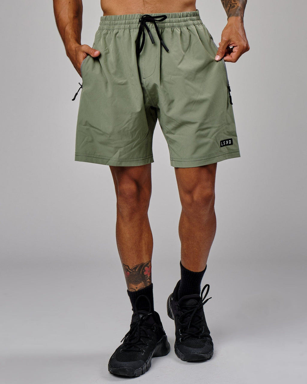 Model wearing Rep 7" Performance Short - Sea Spray