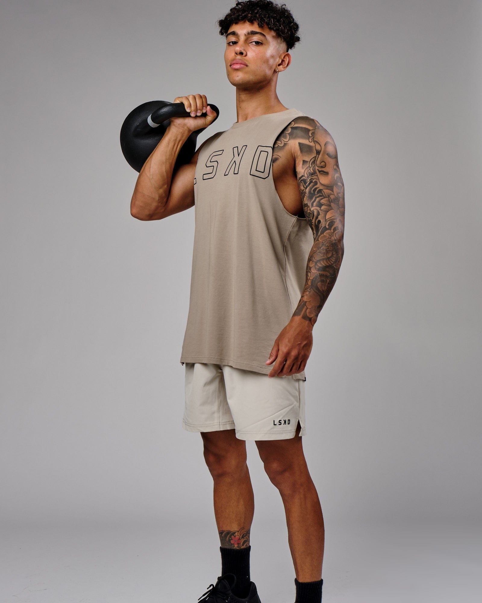 Model wearing Intensity 7" Performance Short - Bone