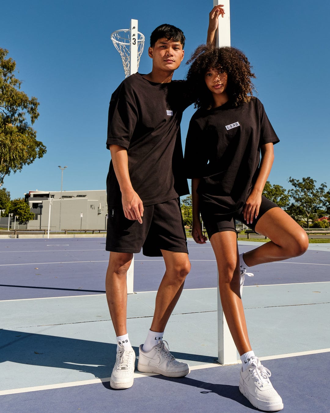 Model wearing Unisex Cornerstone Tee Oversize - Black