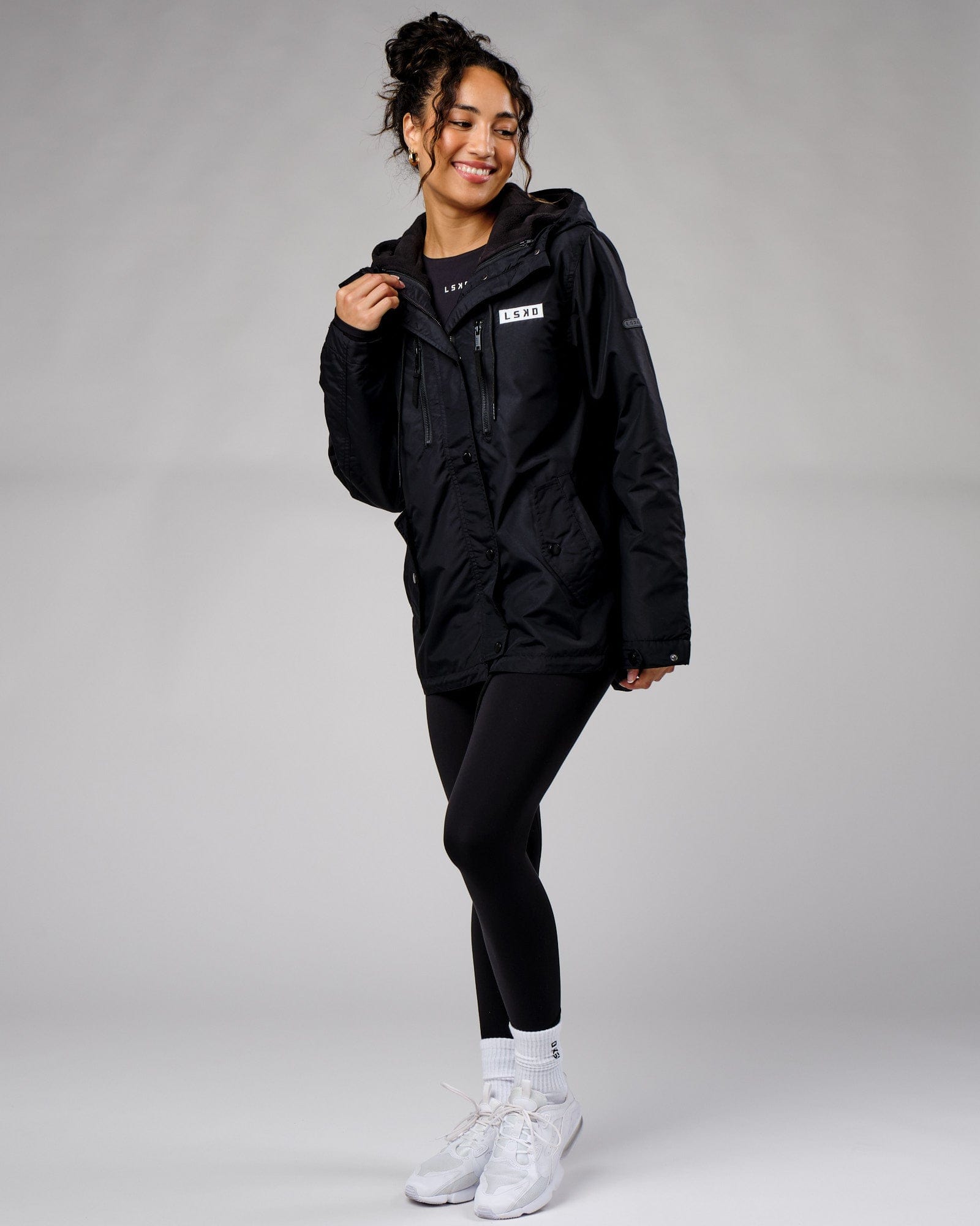 Model wearing Unisex Tack Anorak Jacket - Black