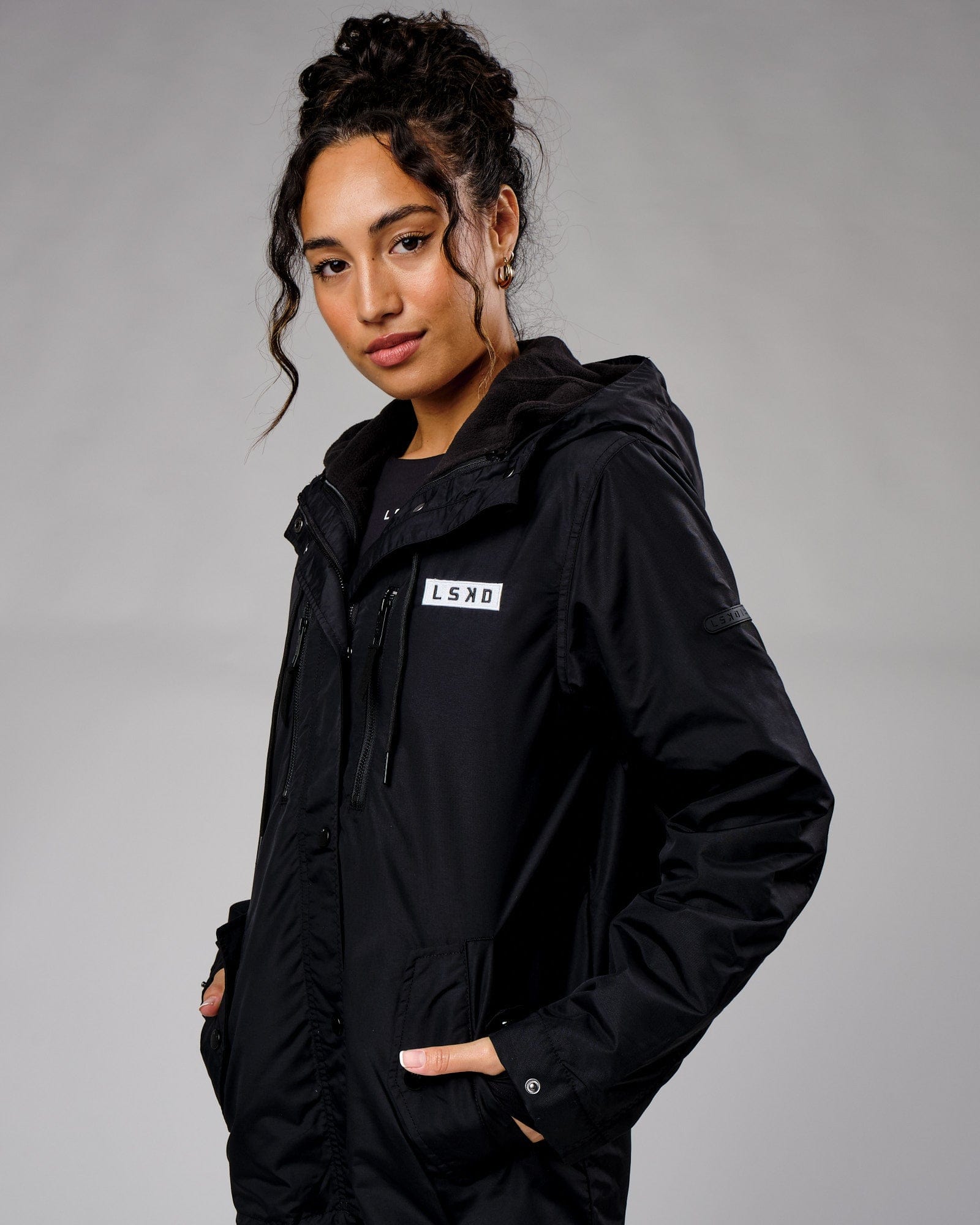 Model wearing Unisex Tack Anorak Jacket - Black