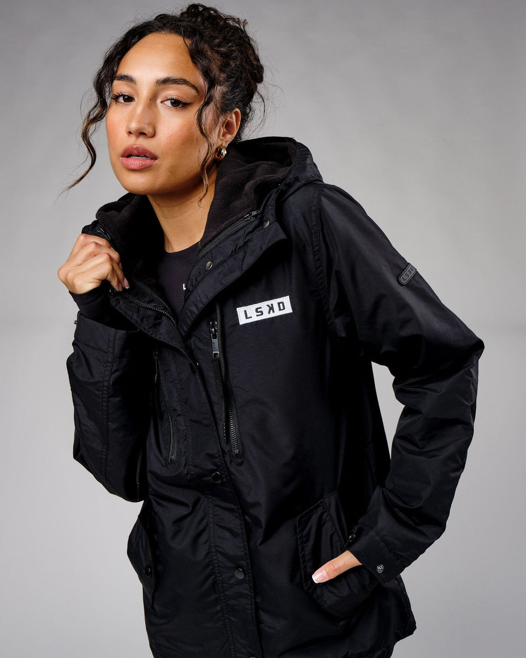 Model wearing Unisex Tack Anorak Jacket - Black