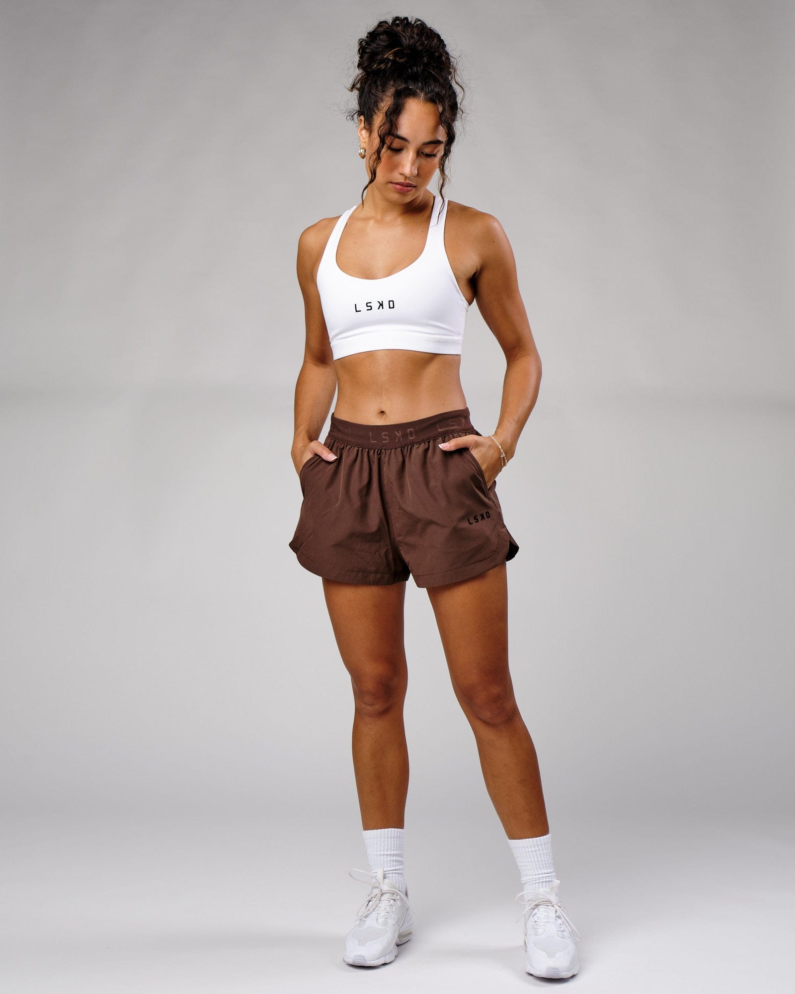 Model wearing Competition Performance Short - Walnut