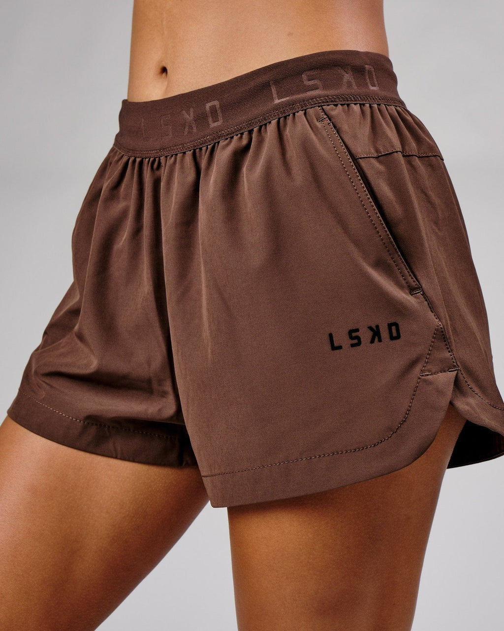 Model wearing Competition Performance Short - Walnut