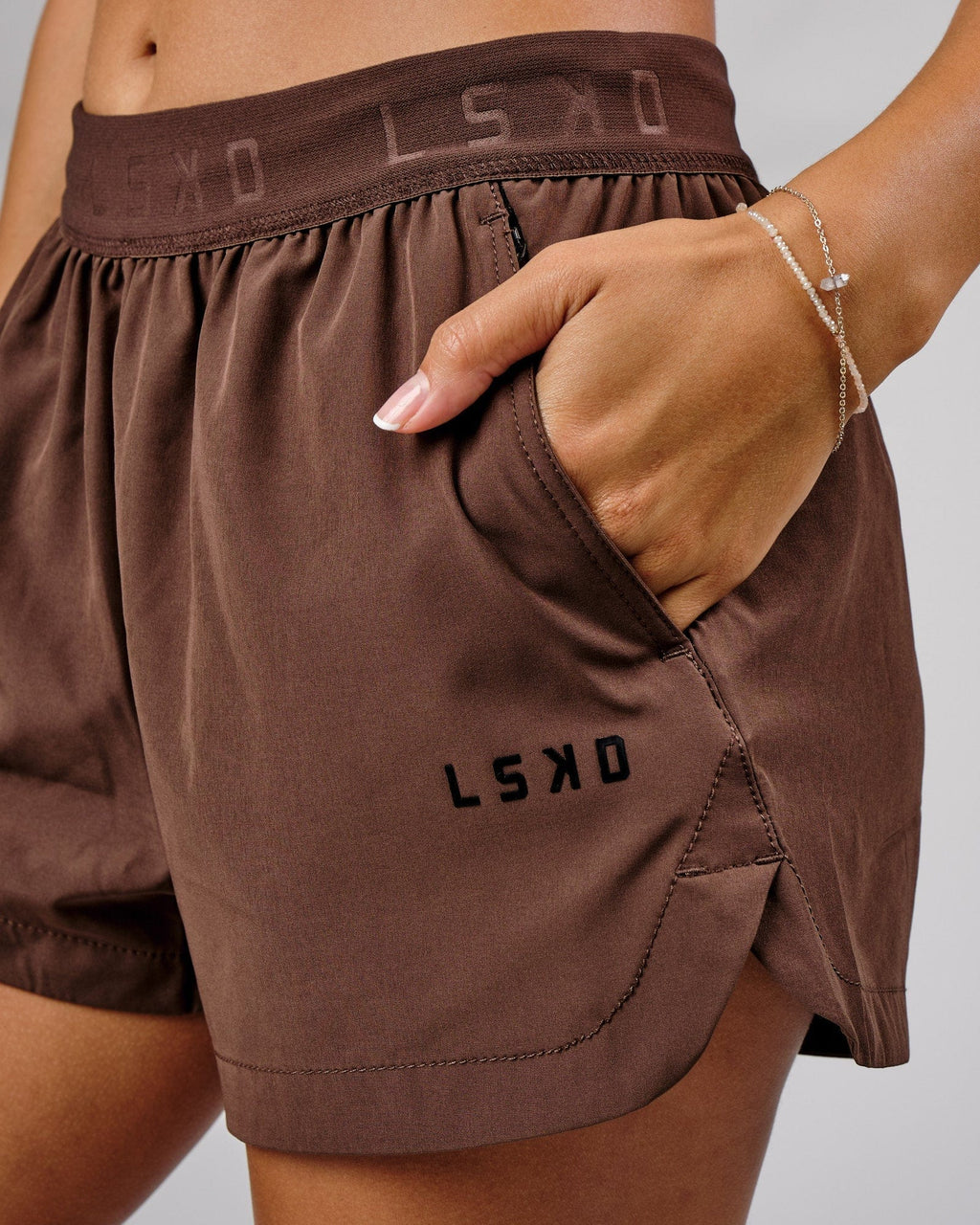 Model wearing Competition Performance Short - Walnut