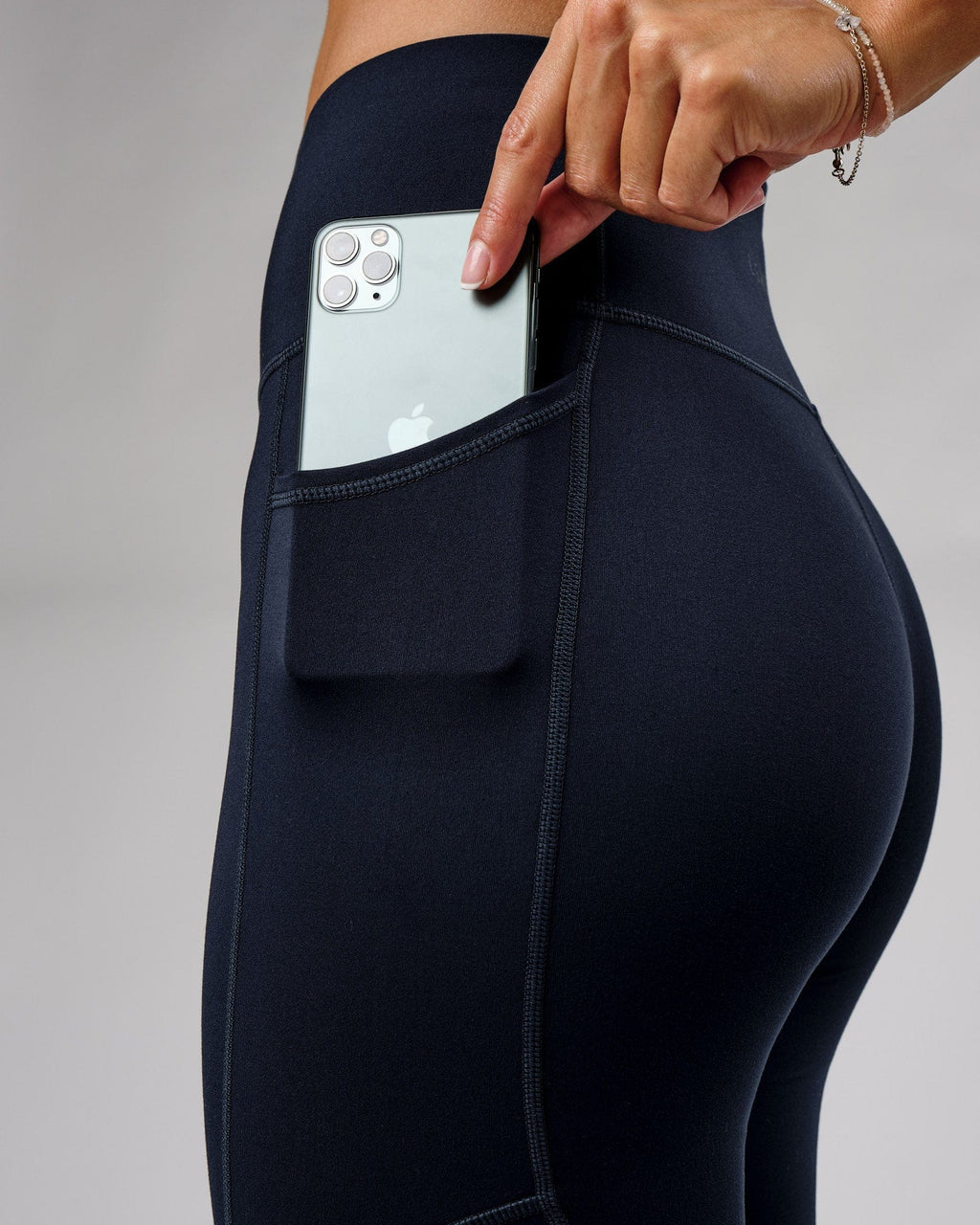 Model wearing Rep Full Length Tight Small Logo - Navy