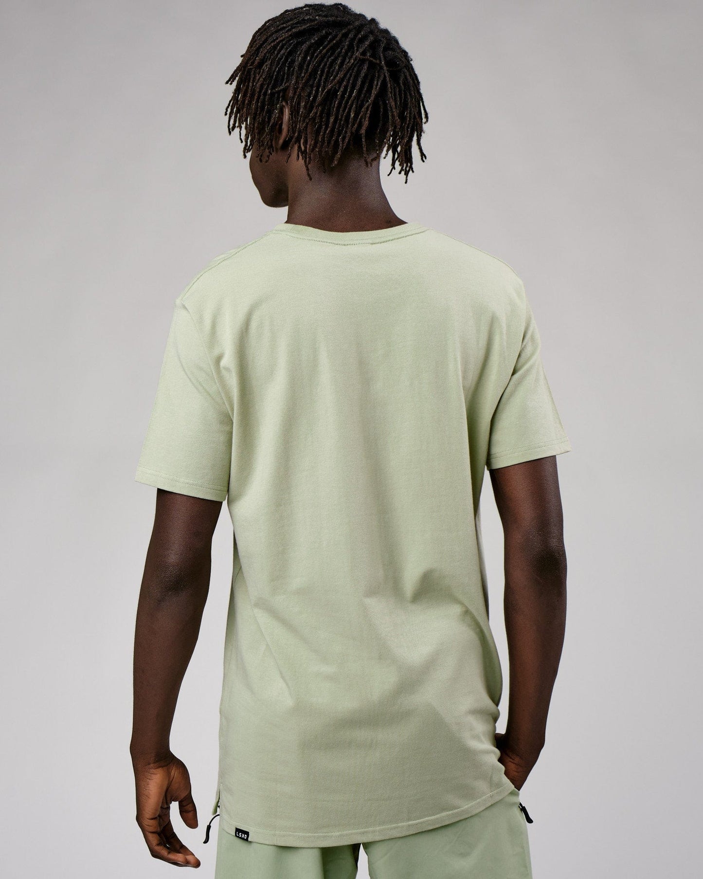 Model wearing Expand FLXCotton Tee - Desert Sage
