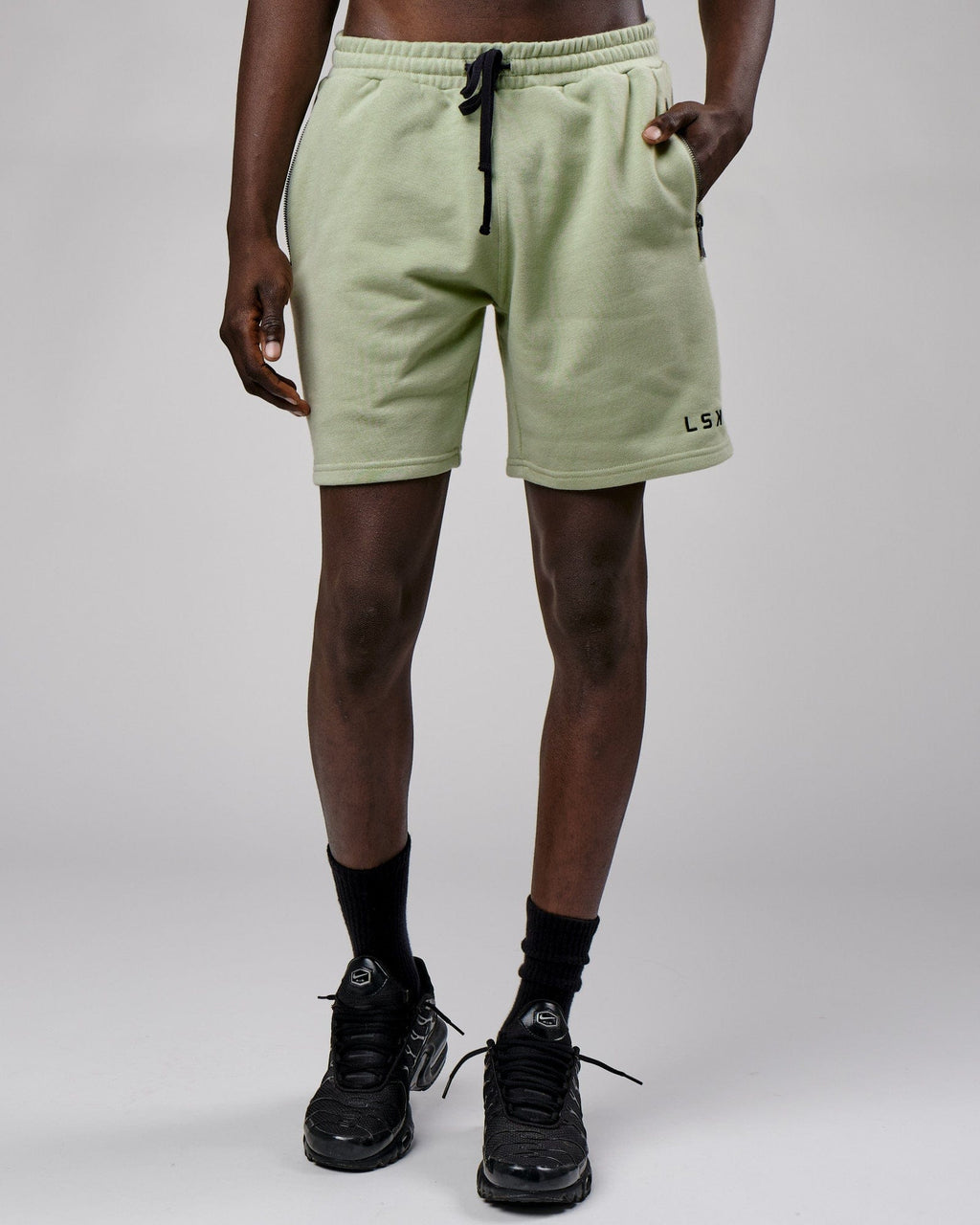 Model wearing Connor Track Short - Desert Sage