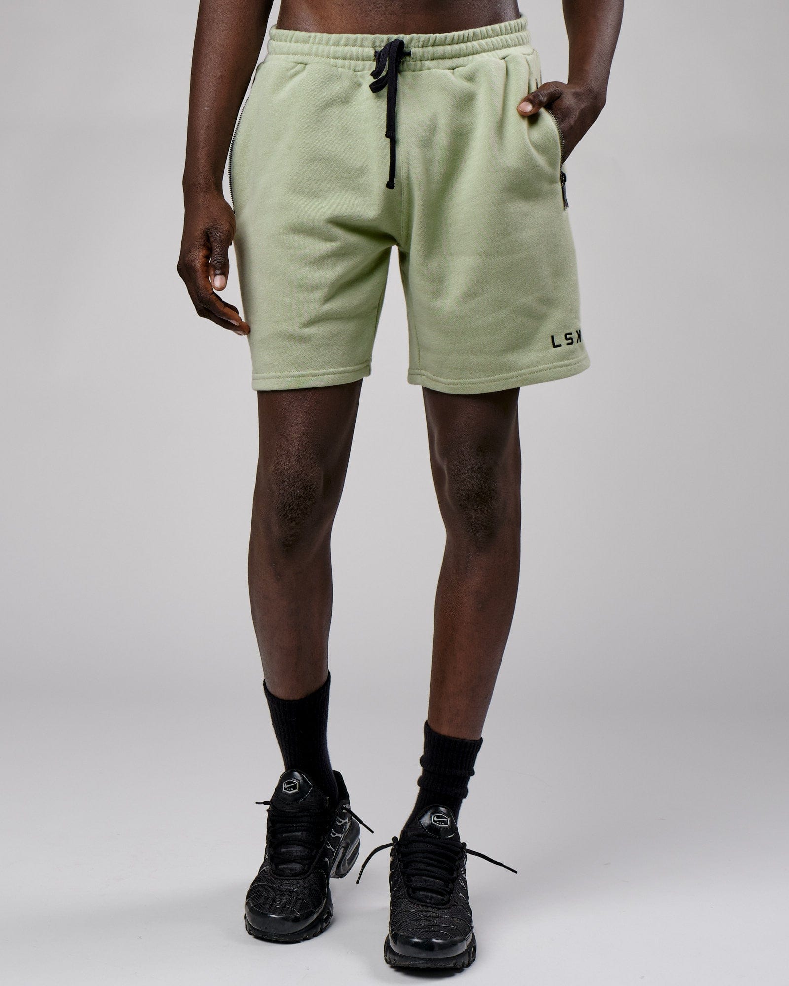Model wearing Connor Track Short - Desert Sage