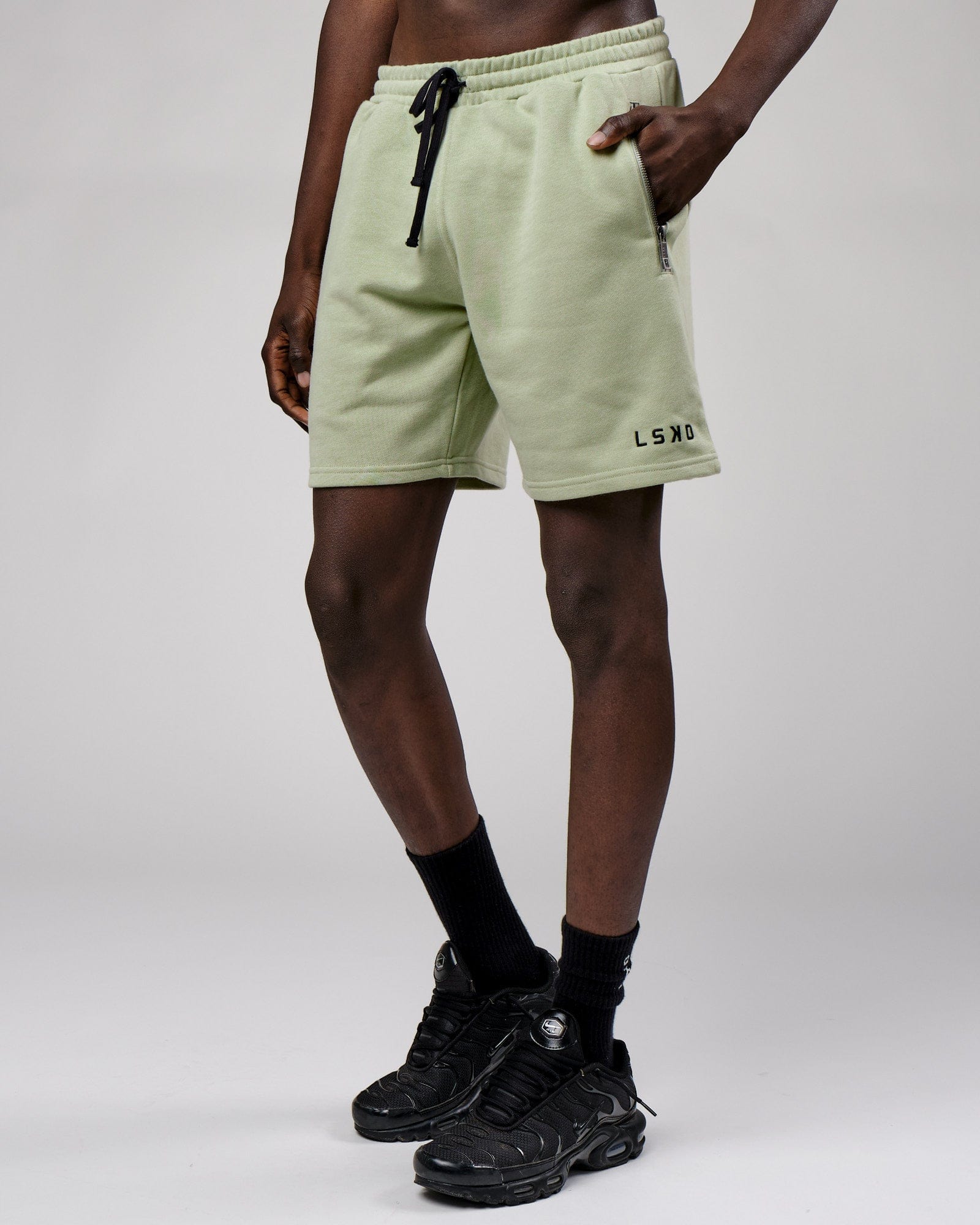 Model wearing Connor Track Short - Desert Sage