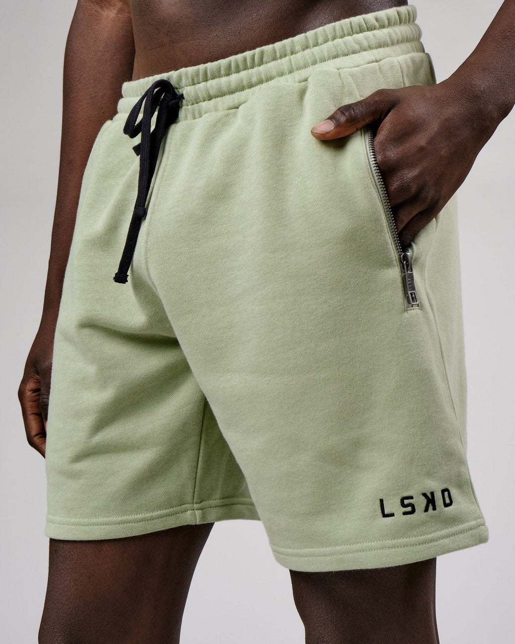 Model wearing Connor Track Short - Desert Sage