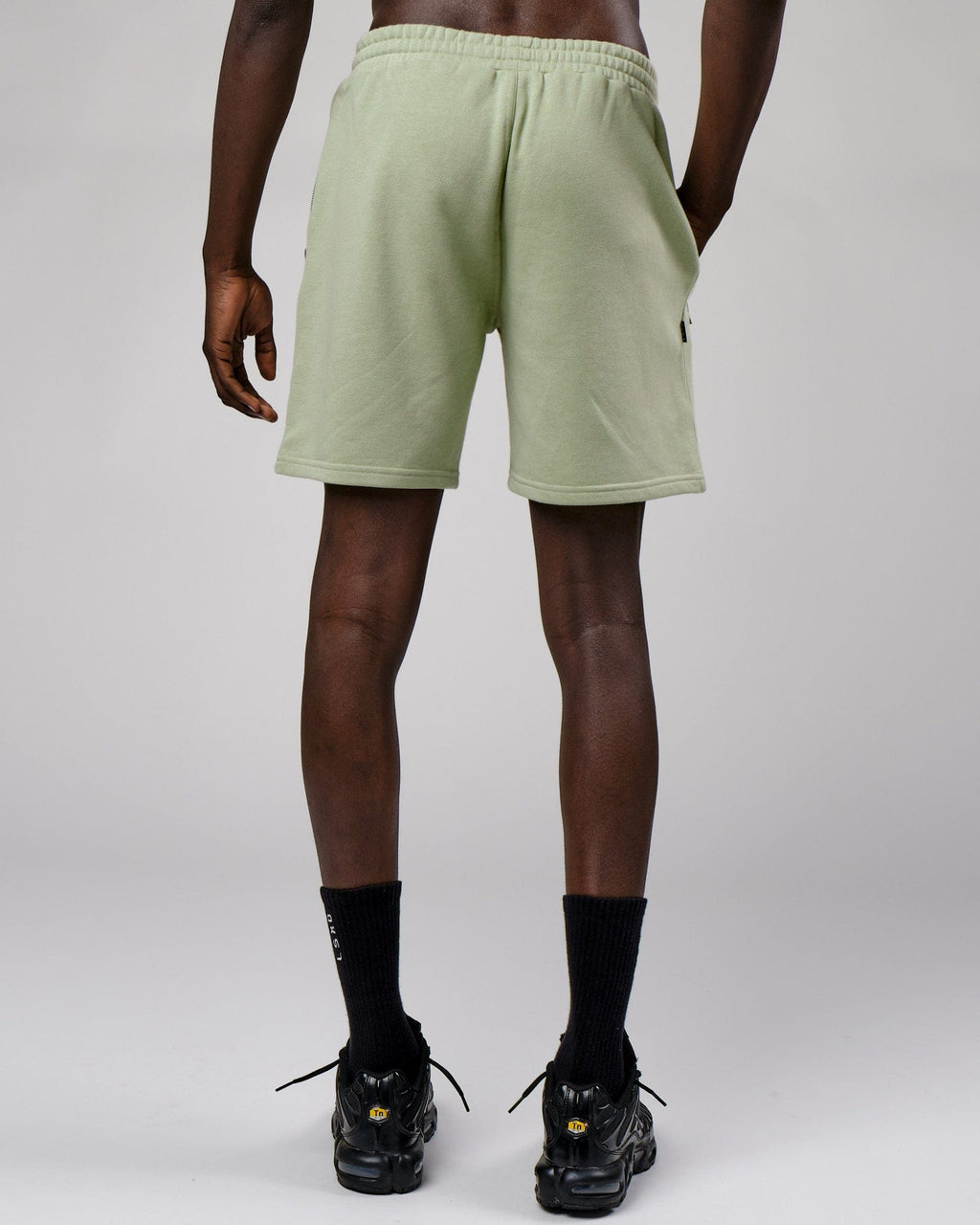 Model wearing Connor Track Short - Desert Sage