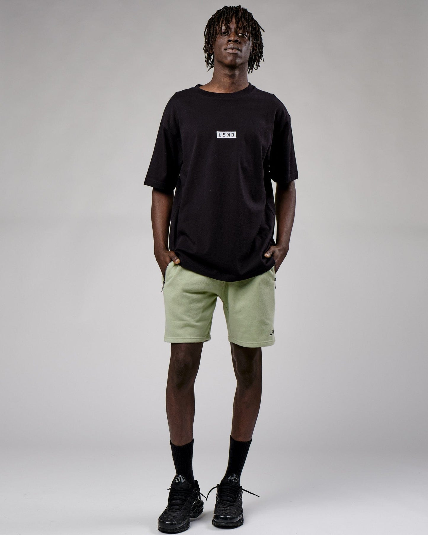 Model wearing Cornerstone Tee Oversize - Black