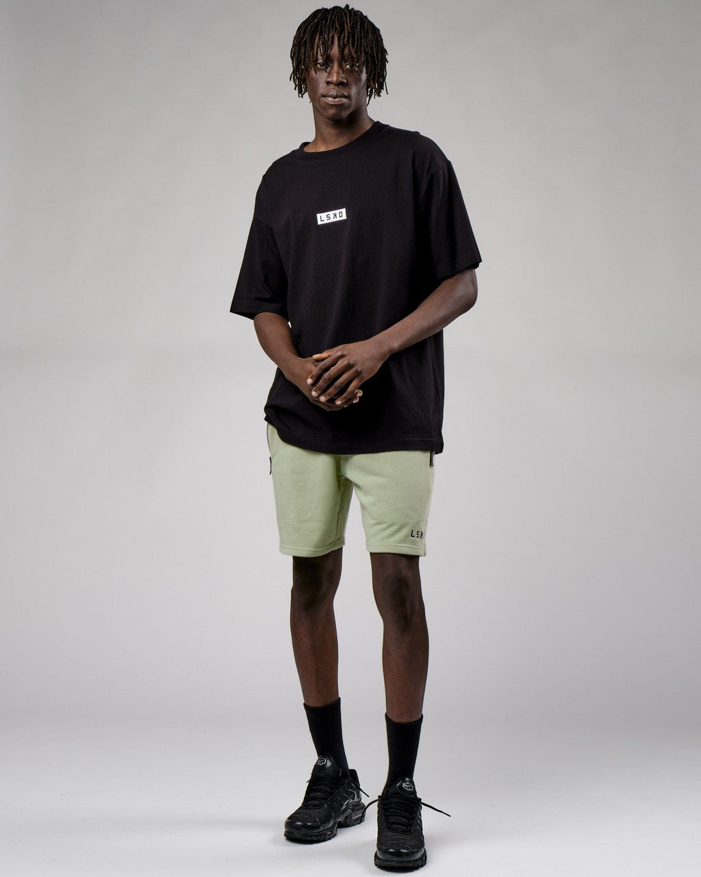 Model wearing Connor Track Short - Desert Sage