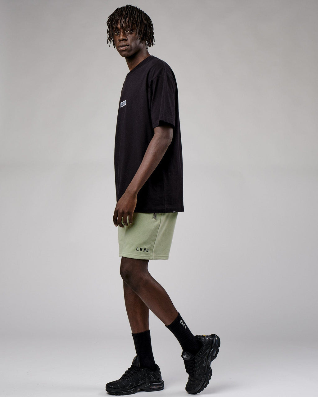 Model wearing Connor Track Short - Desert Sage