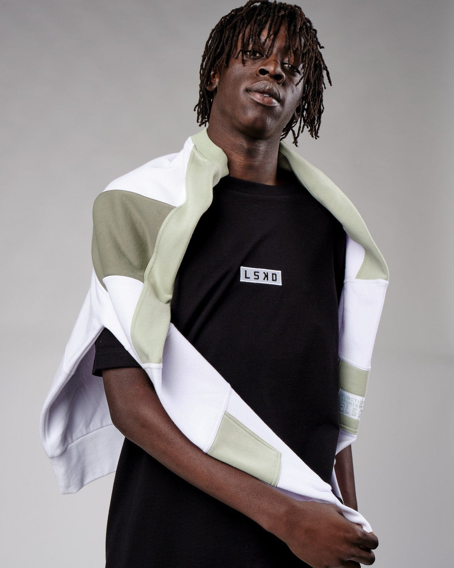 Model wearing Cornerstone Tee Oversize - Black