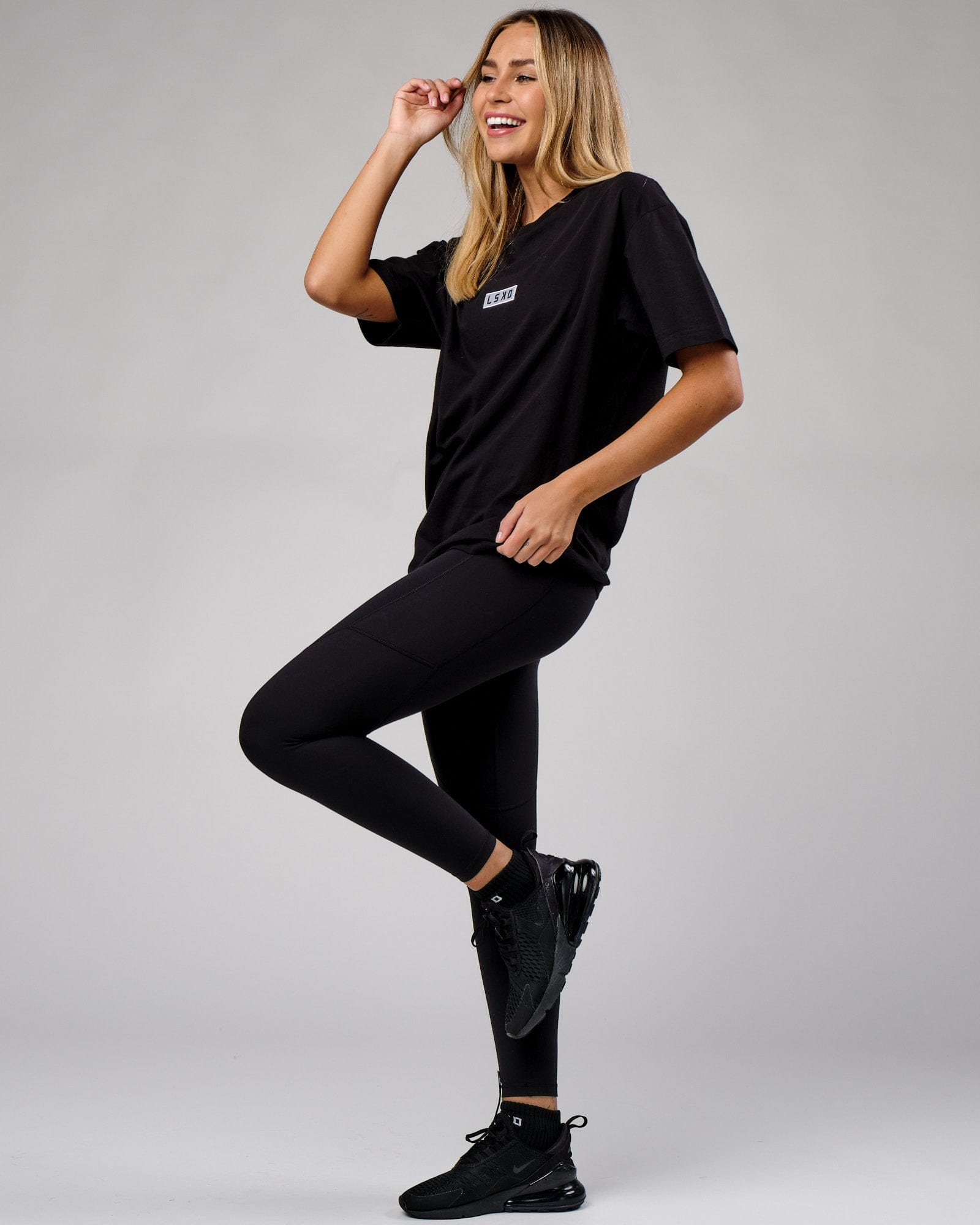 Model wearing Unisex Cornerstone Tee Oversize - Black