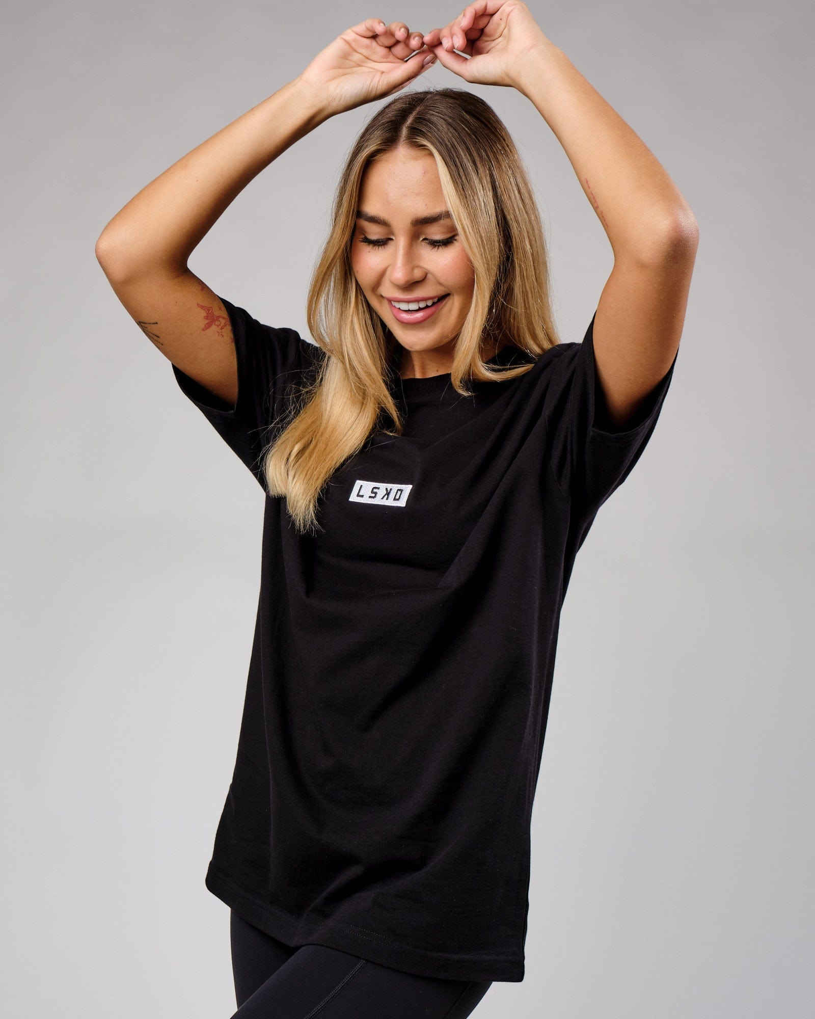 Model wearing Unisex Cornerstone Tee Oversize - Black