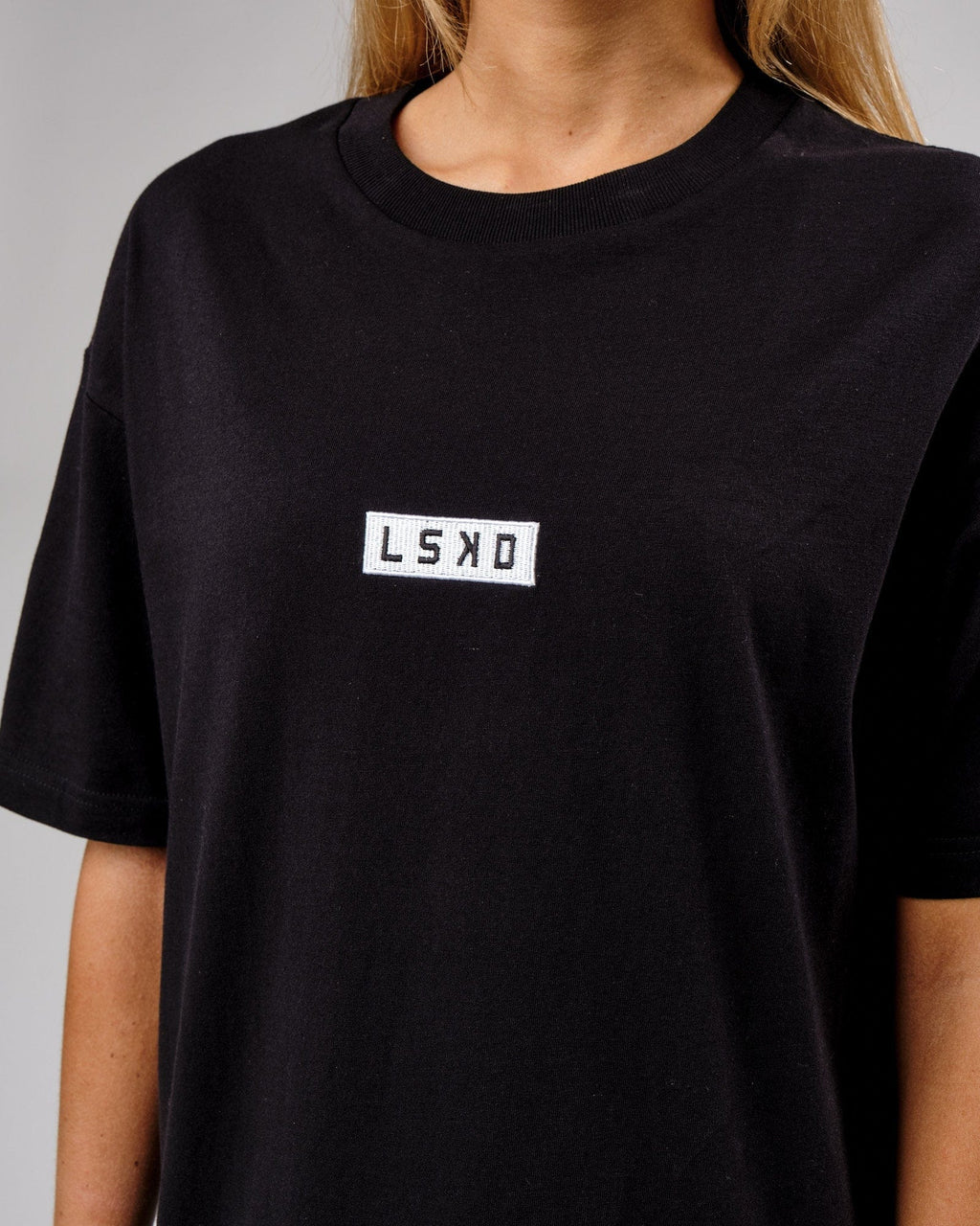 Model wearing Unisex Cornerstone Tee Oversize - Black