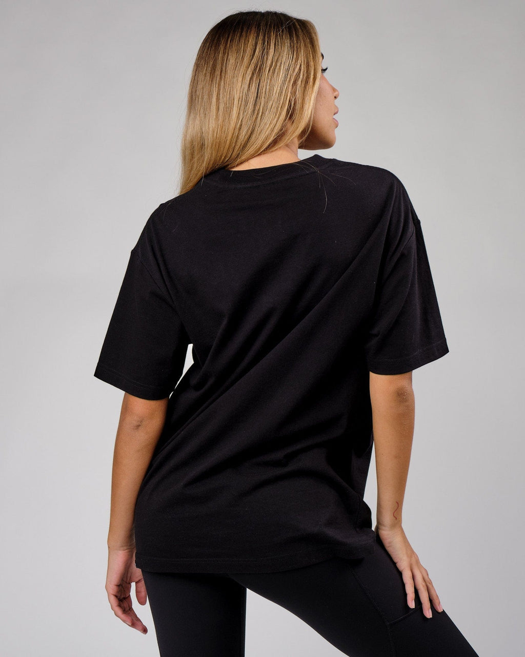 Model wearing Unisex Cornerstone Tee Oversize - Black