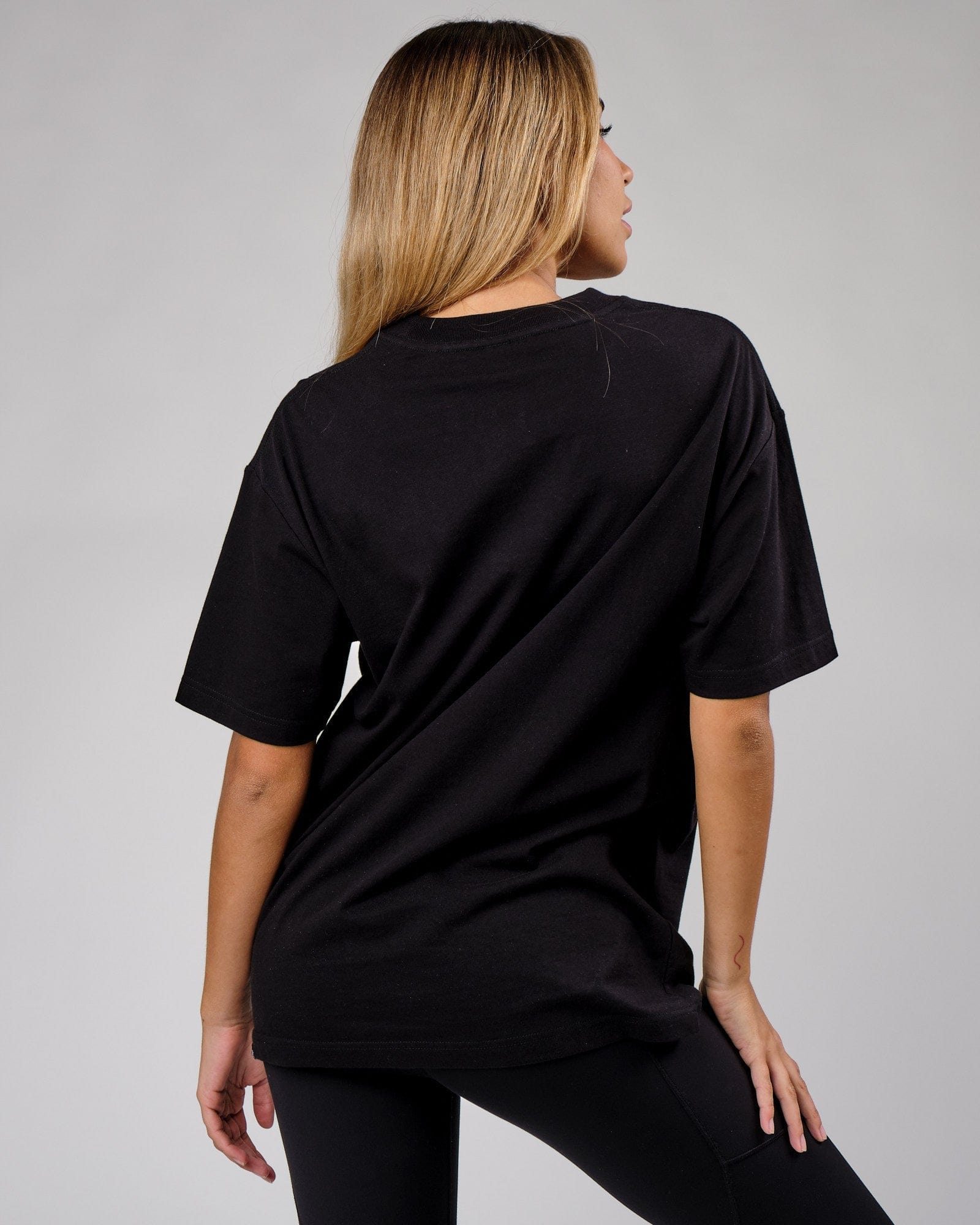 Model wearing Unisex Cornerstone Tee Oversize - Black