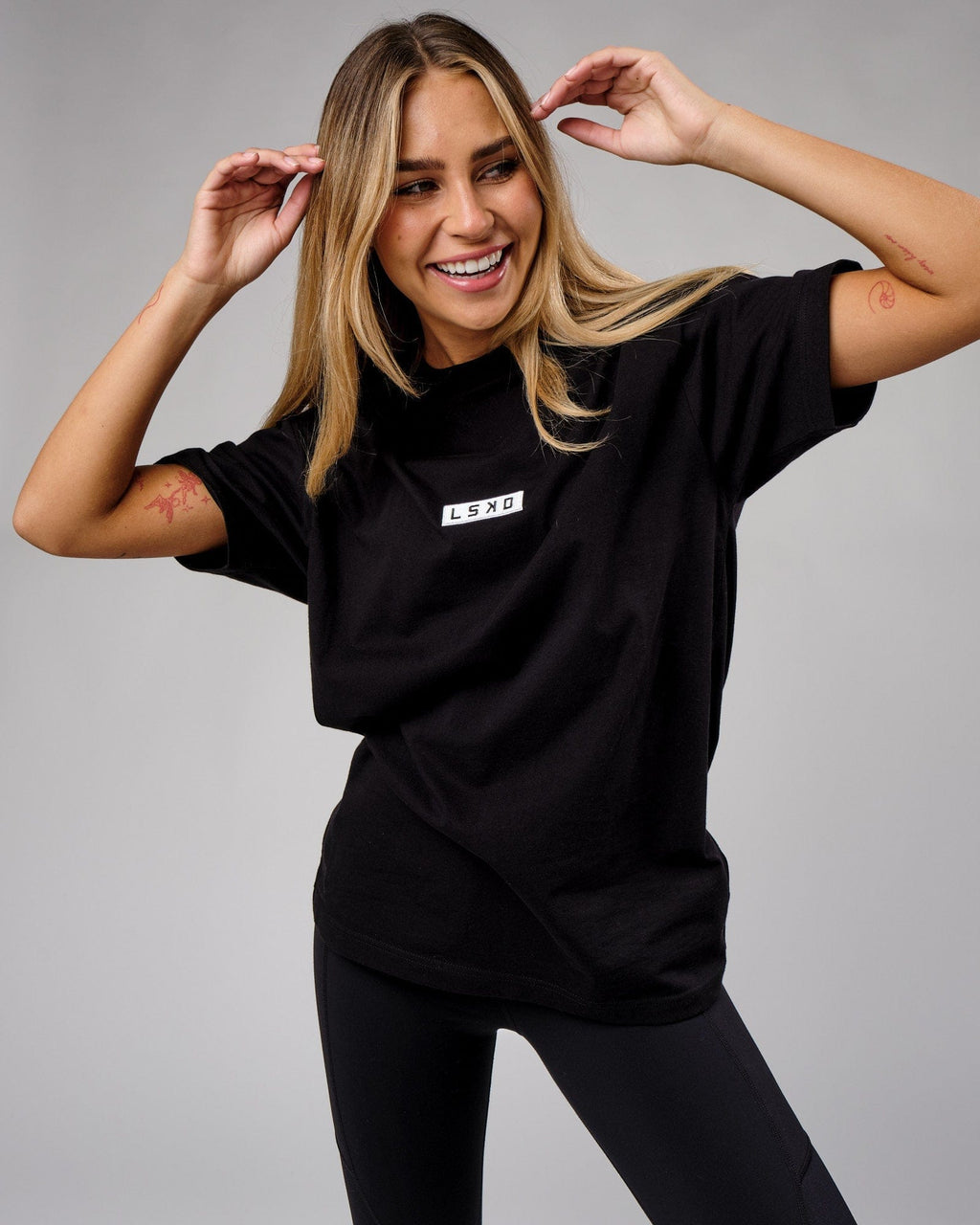 Model wearing Unisex Cornerstone Tee Oversize - Black