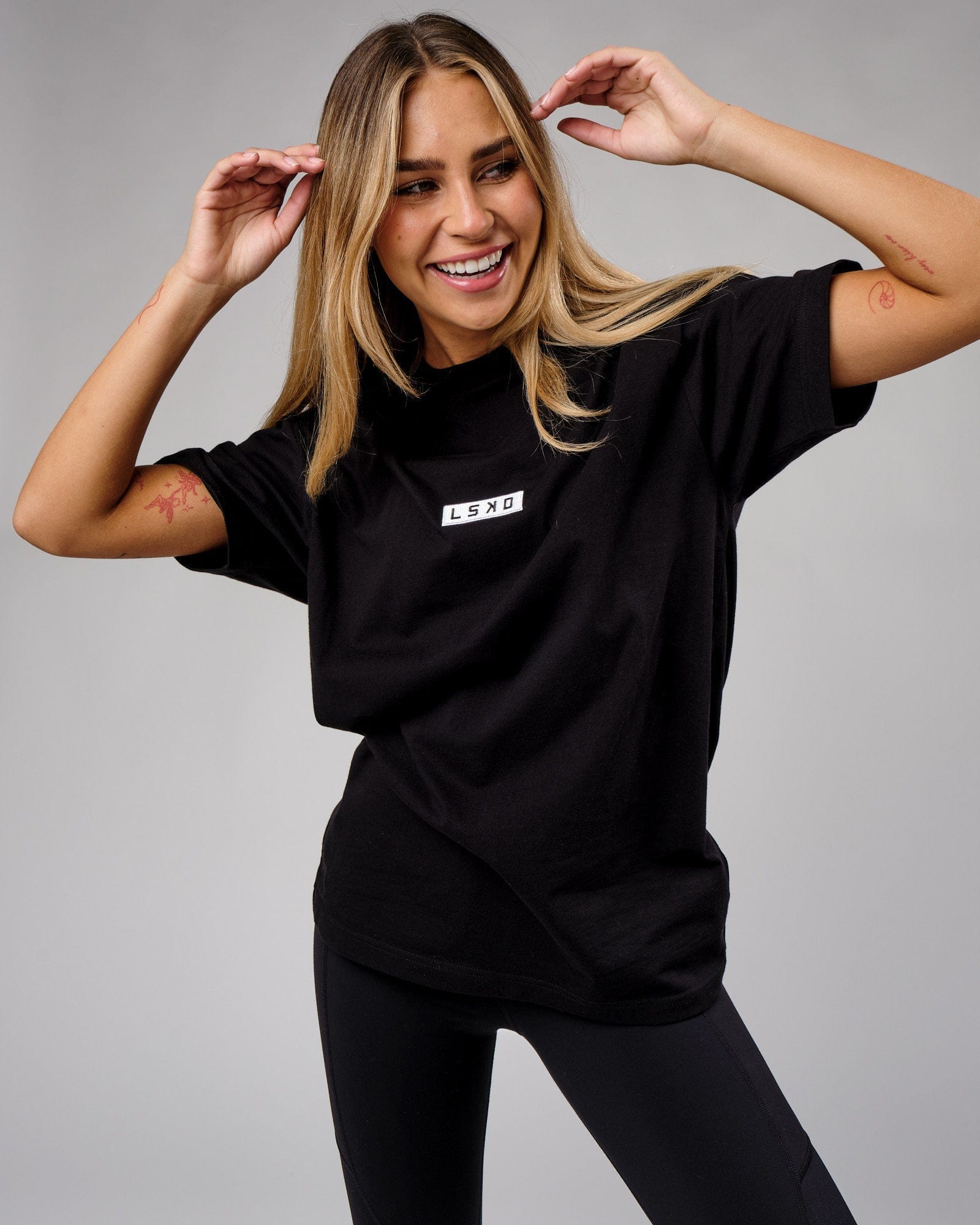 Model wearing Unisex Cornerstone Tee Oversize - Black