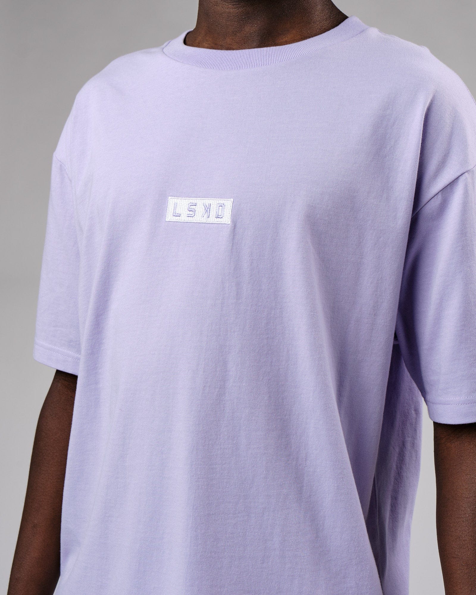 Model wearing Cornerstone Tee Oversize - Cosmic Sky