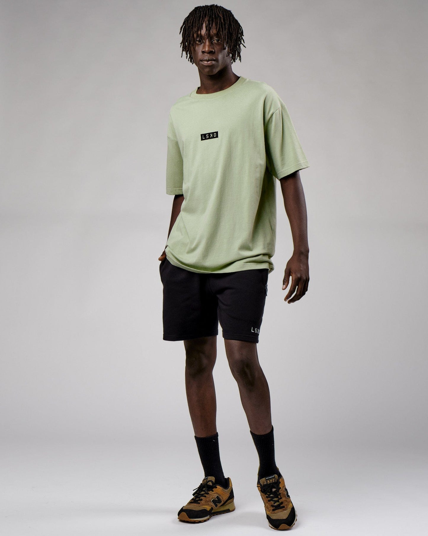 Model wearing Cornerstone Tee Oversize - Desert Sage