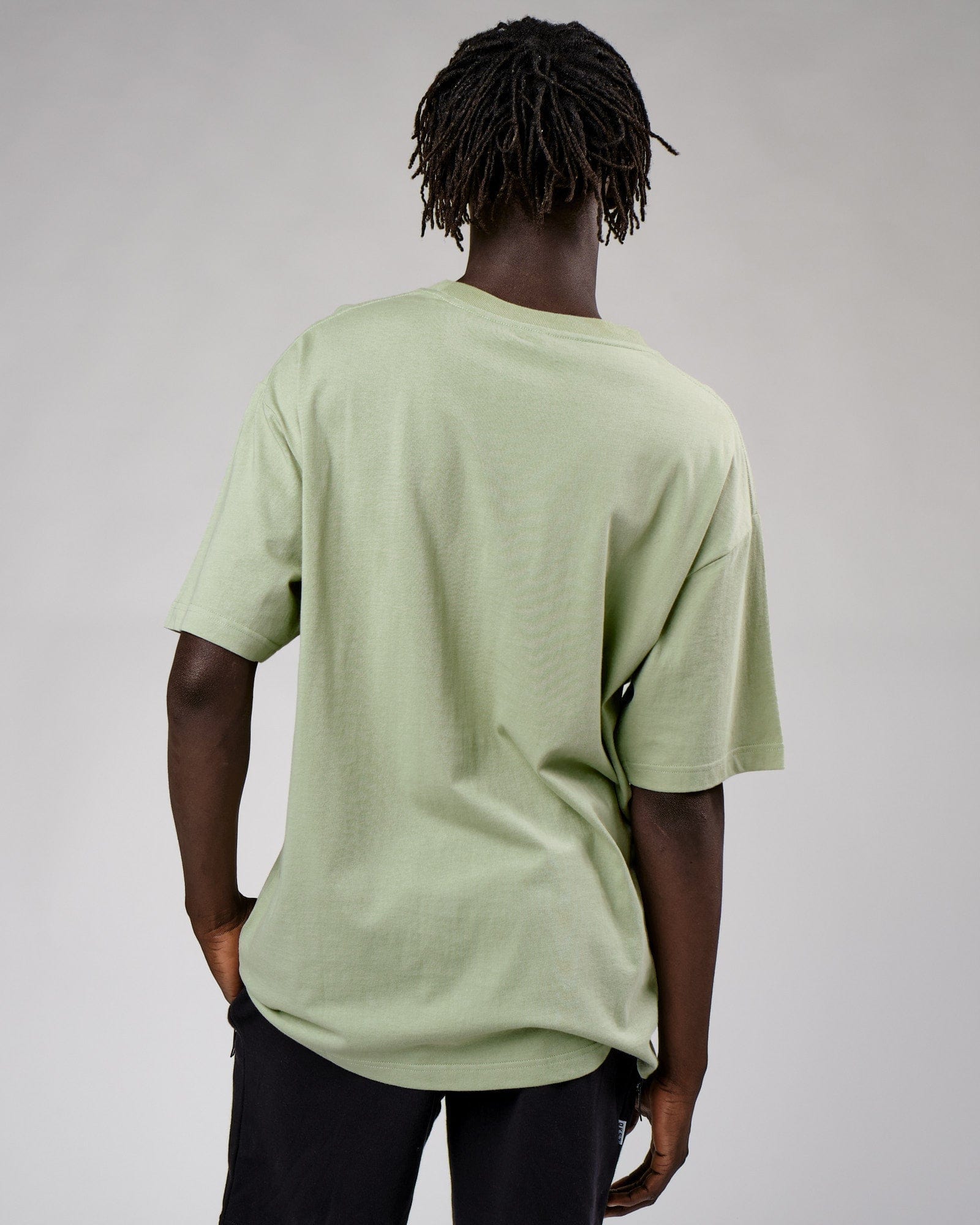 Model wearing Cornerstone Tee Oversize - Desert Sage