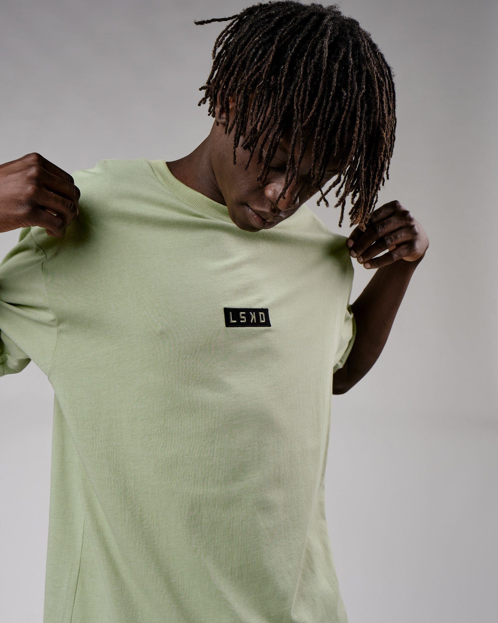 Model wearing Cornerstone Tee Oversize - Desert Sage