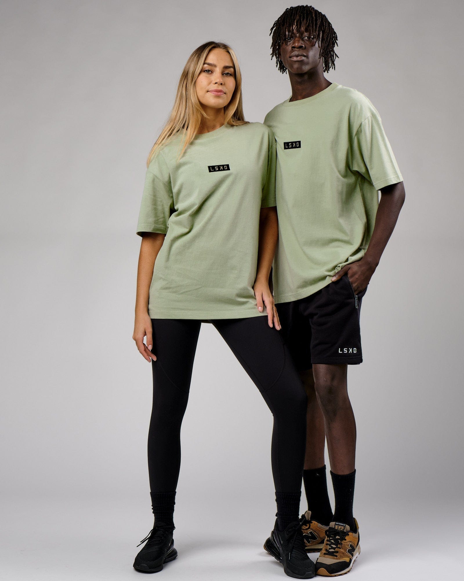 Model wearing Unisex Cornerstone Tee Oversize - Desert Sage