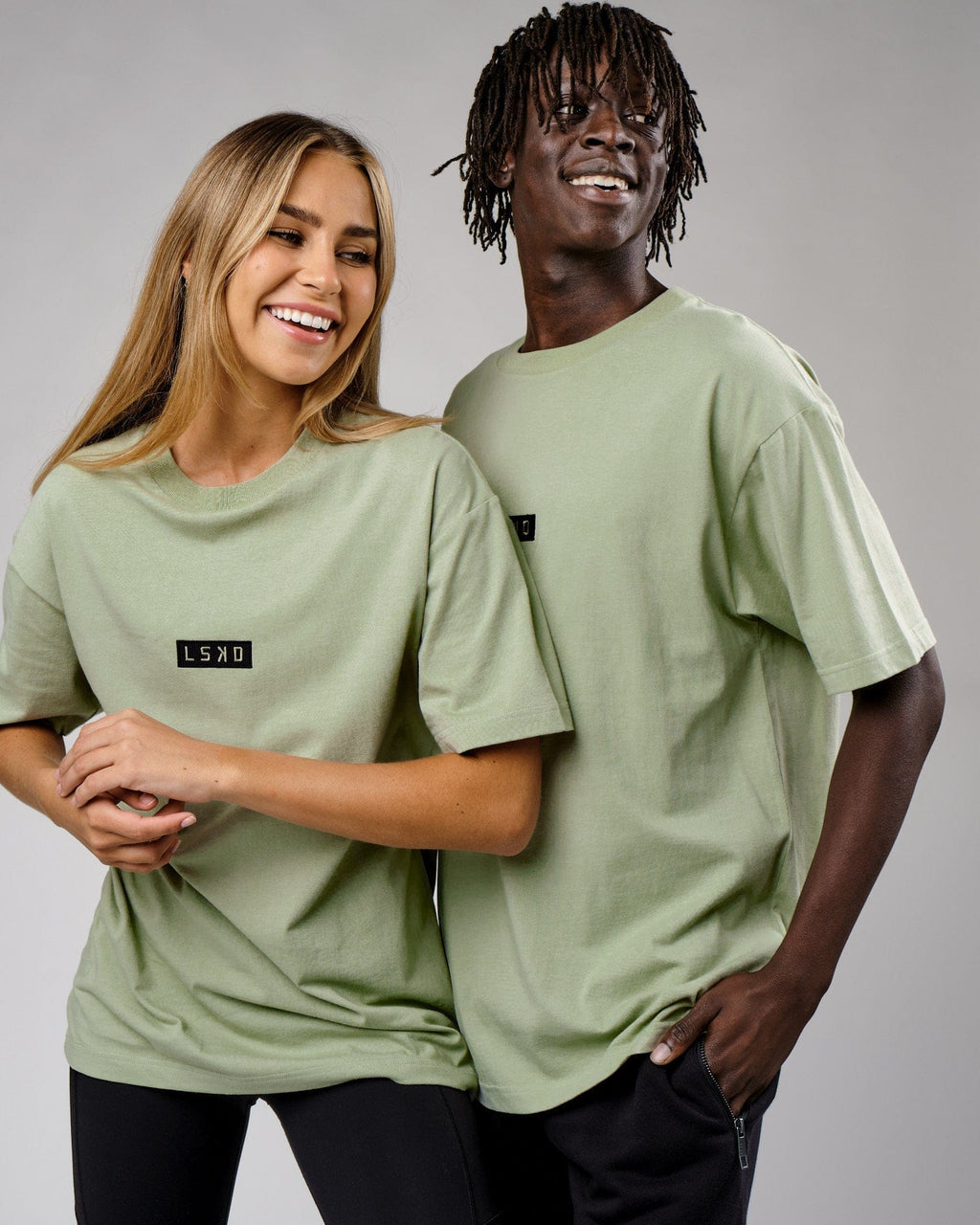 Model wearing Unisex Cornerstone Tee Oversize - Desert Sage