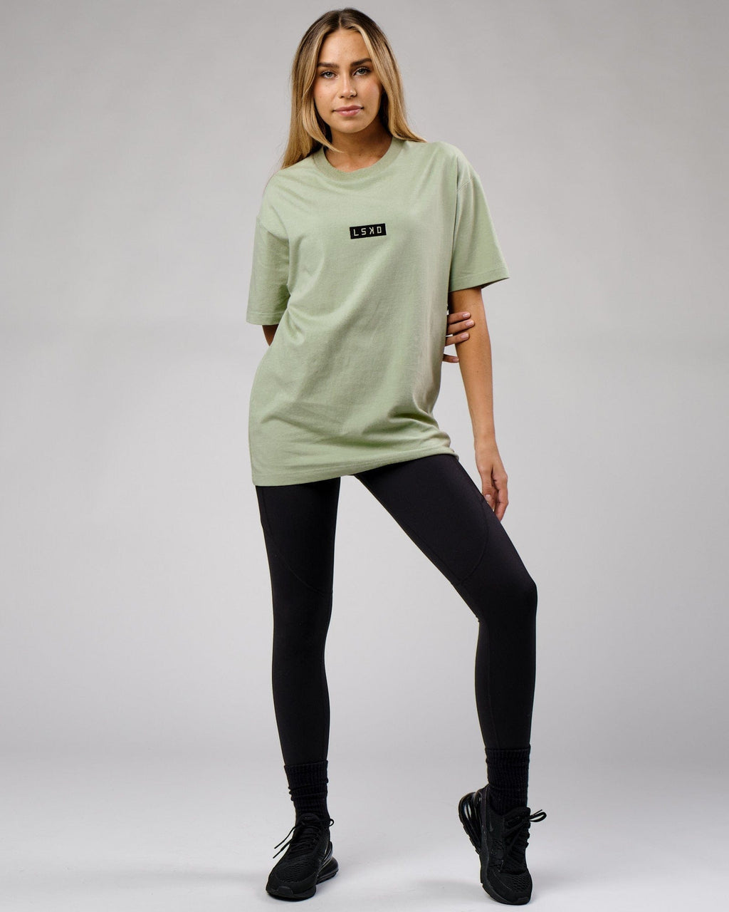 Model wearing Unisex Cornerstone Tee Oversize - Desert Sage