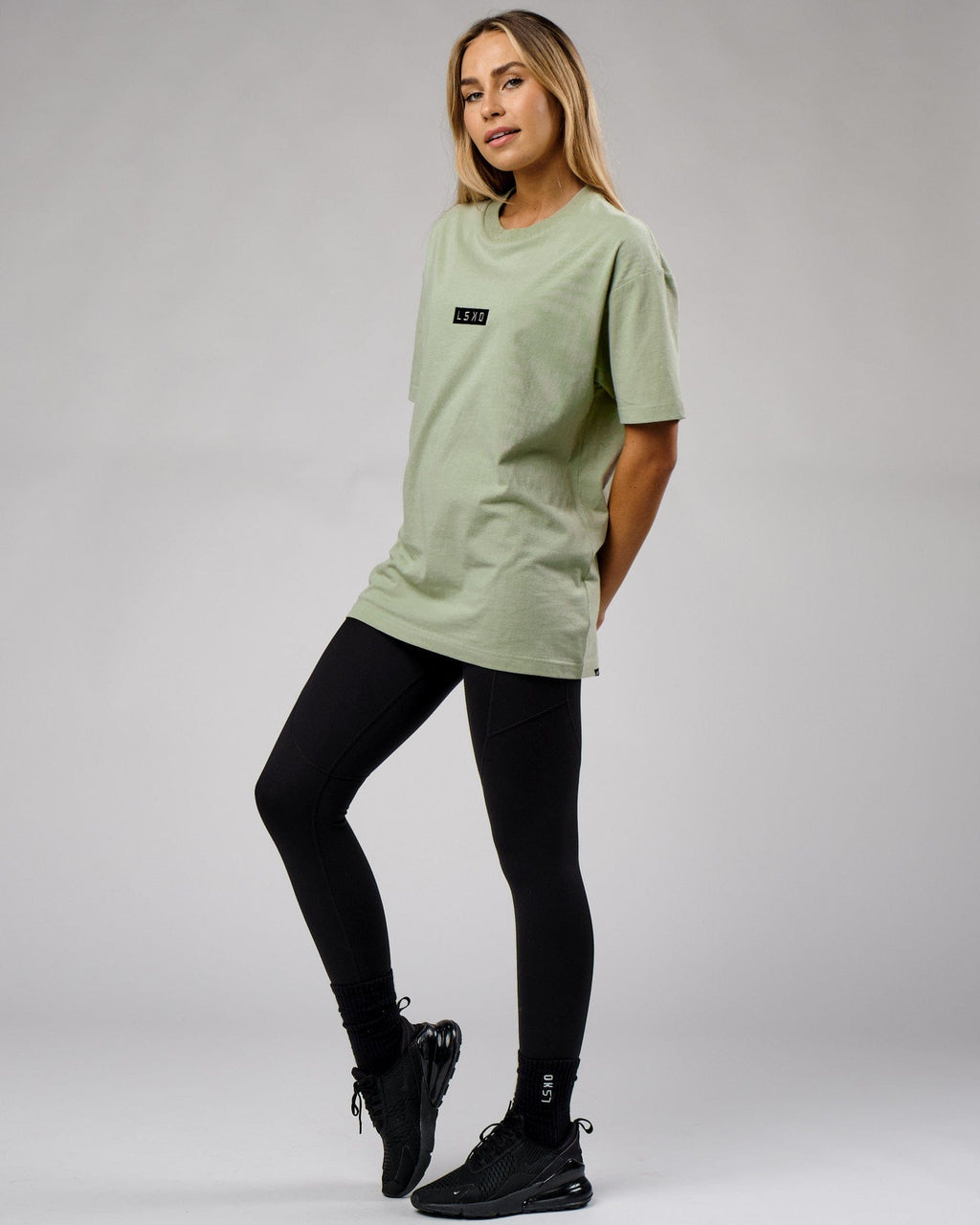 Model wearing Unisex Cornerstone Tee Oversize - Desert Sage