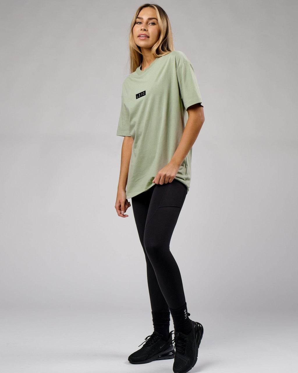 Model wearing Unisex Cornerstone Tee Oversize - Desert Sage